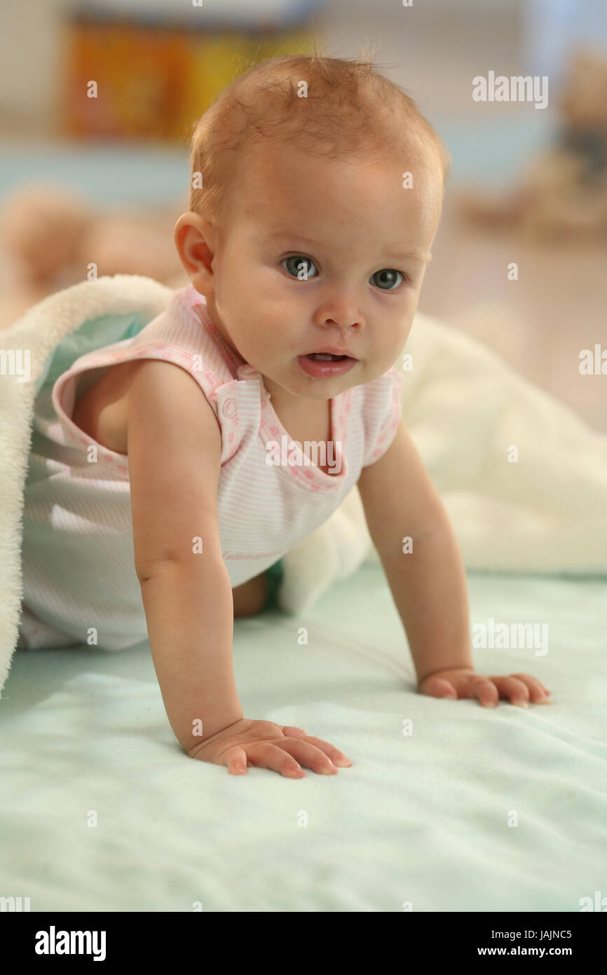 Baby,6 months,creep,play,dresses,discoveries,Indoor,learn,girls,people,curiously,add support,caps,arms,hands,portrait, Stock Photo