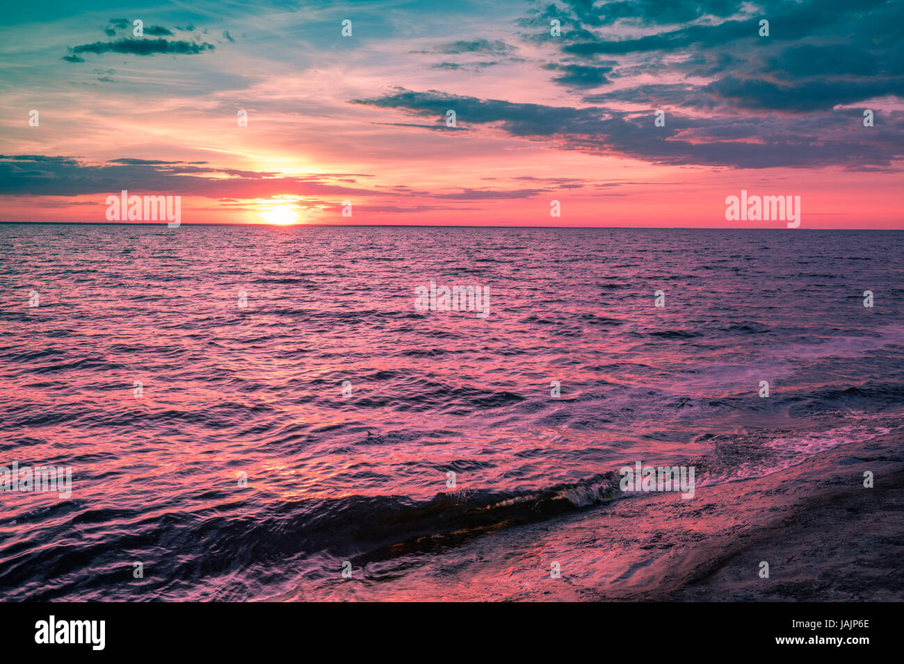 Magic pink sunset over the sea Stock Photo - Alamy