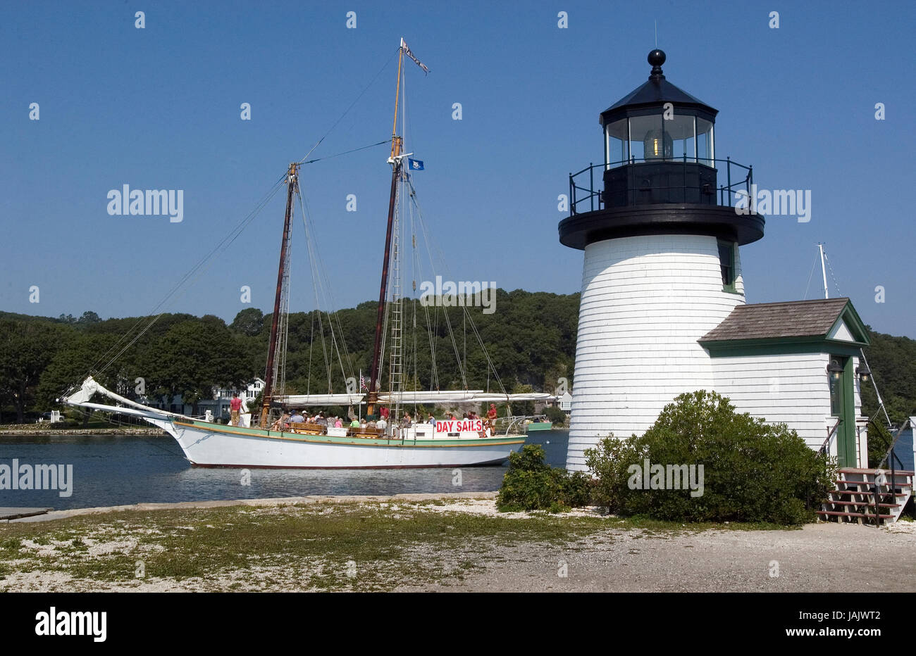 A Schooner passes the lighthouse at Mystic Seaport, Mystic, CT Stock Photo