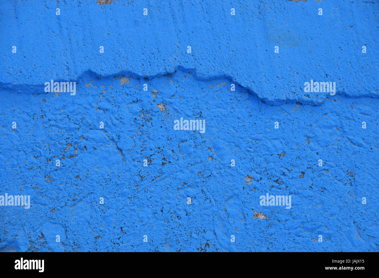 Vivid Blue painted rough concrete wall or floor texture background