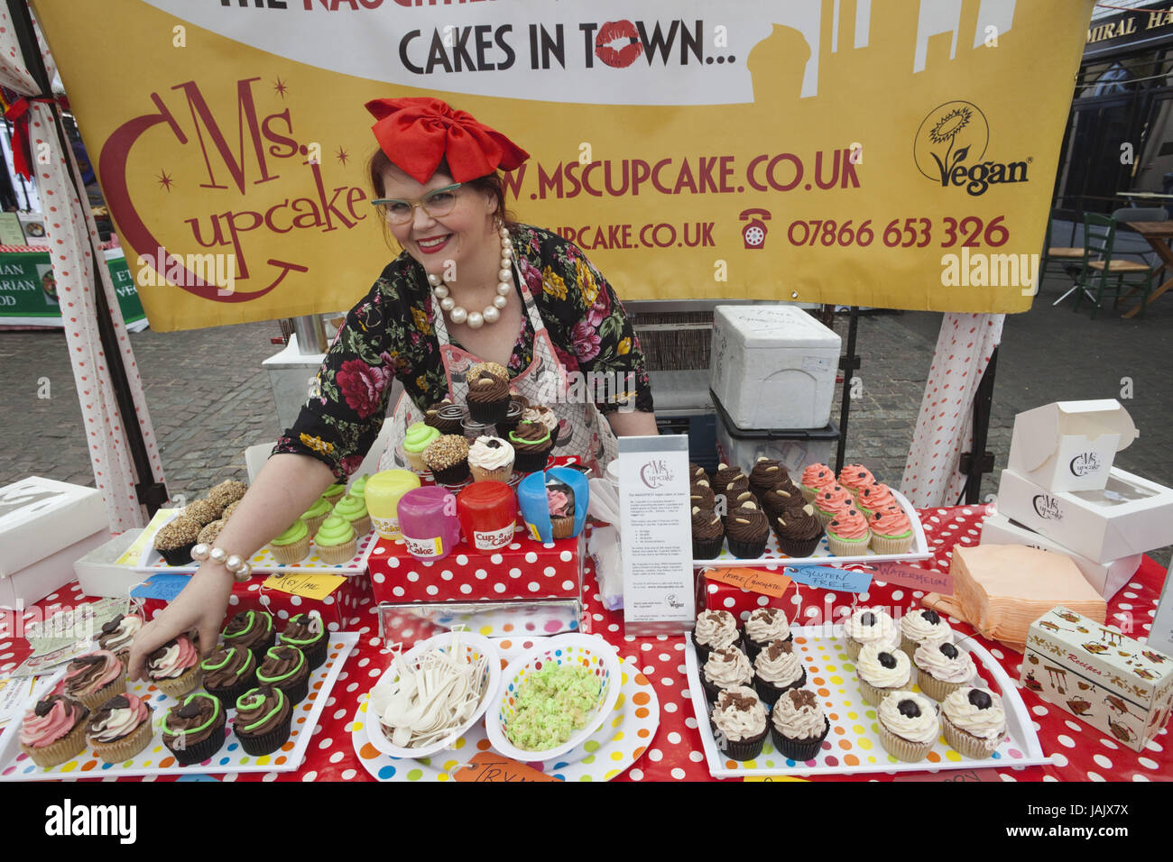 England,London,Greenwich,Greenwich Market,woman,sales booth,muffin,cake, Stock Photo