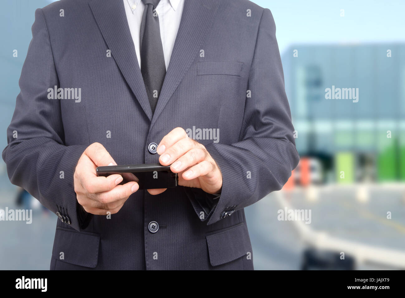 Businessman consulting his agenda on his intelligent electronic device Stock Photo