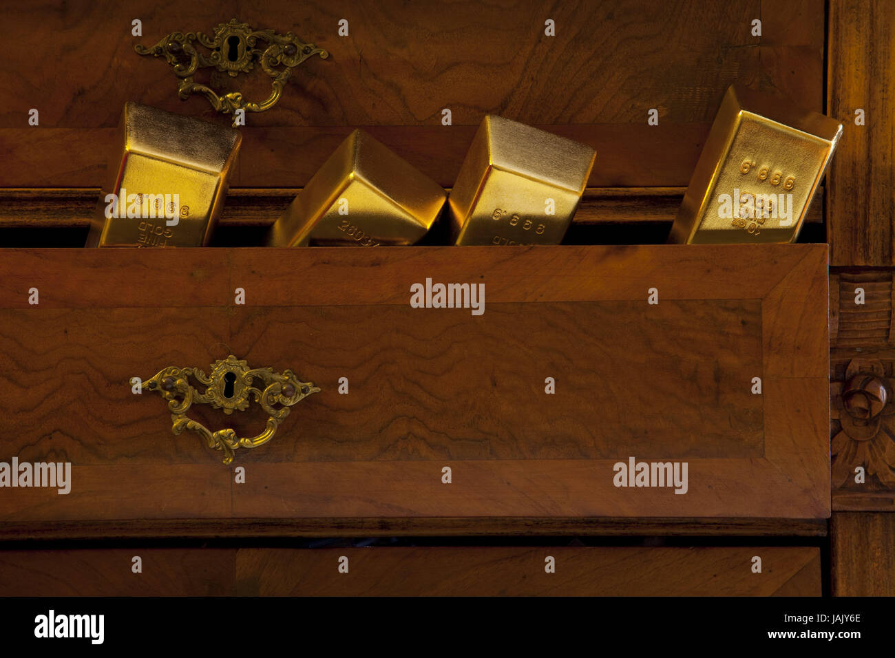 Gold bars,drawer,four,expensive,brilliantly,value,golden price,loss,profit,cupboard,camp down,keep,trust,bank,gold,stamps,purely,purely,frivolously,carelessness,antique,wealth,luxury,richly,uncertainly,chest of drawers,black money,bank crisis,financial crisis, Stock Photo