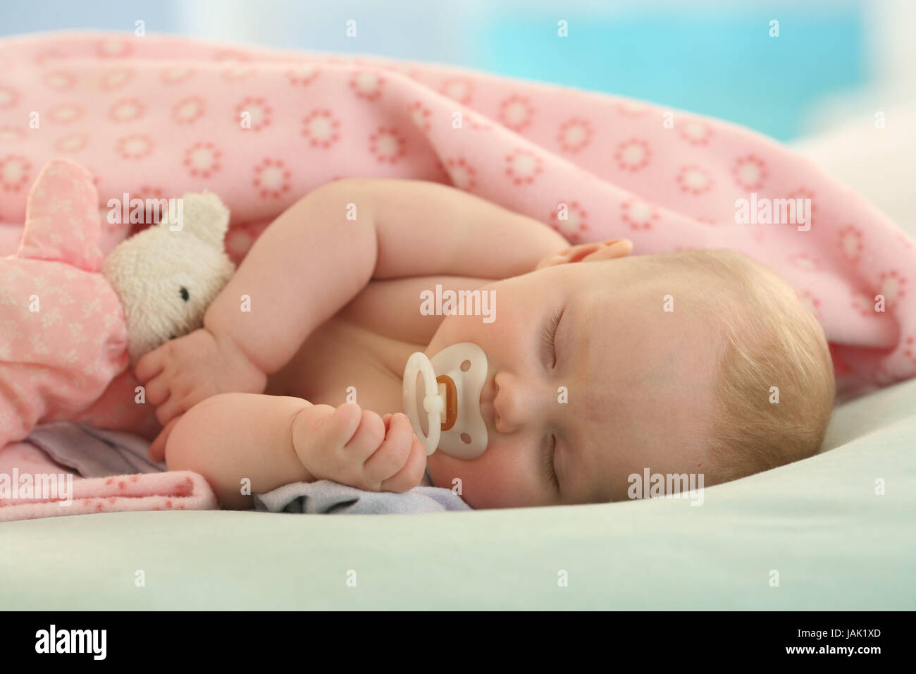 Baby,4 months,dummies,sleep,dream Indoor,girl,person,tiredly,after-lunch sleep,portrait,ceiling,blanket,pink,nonsense animal,rest, Stock Photo