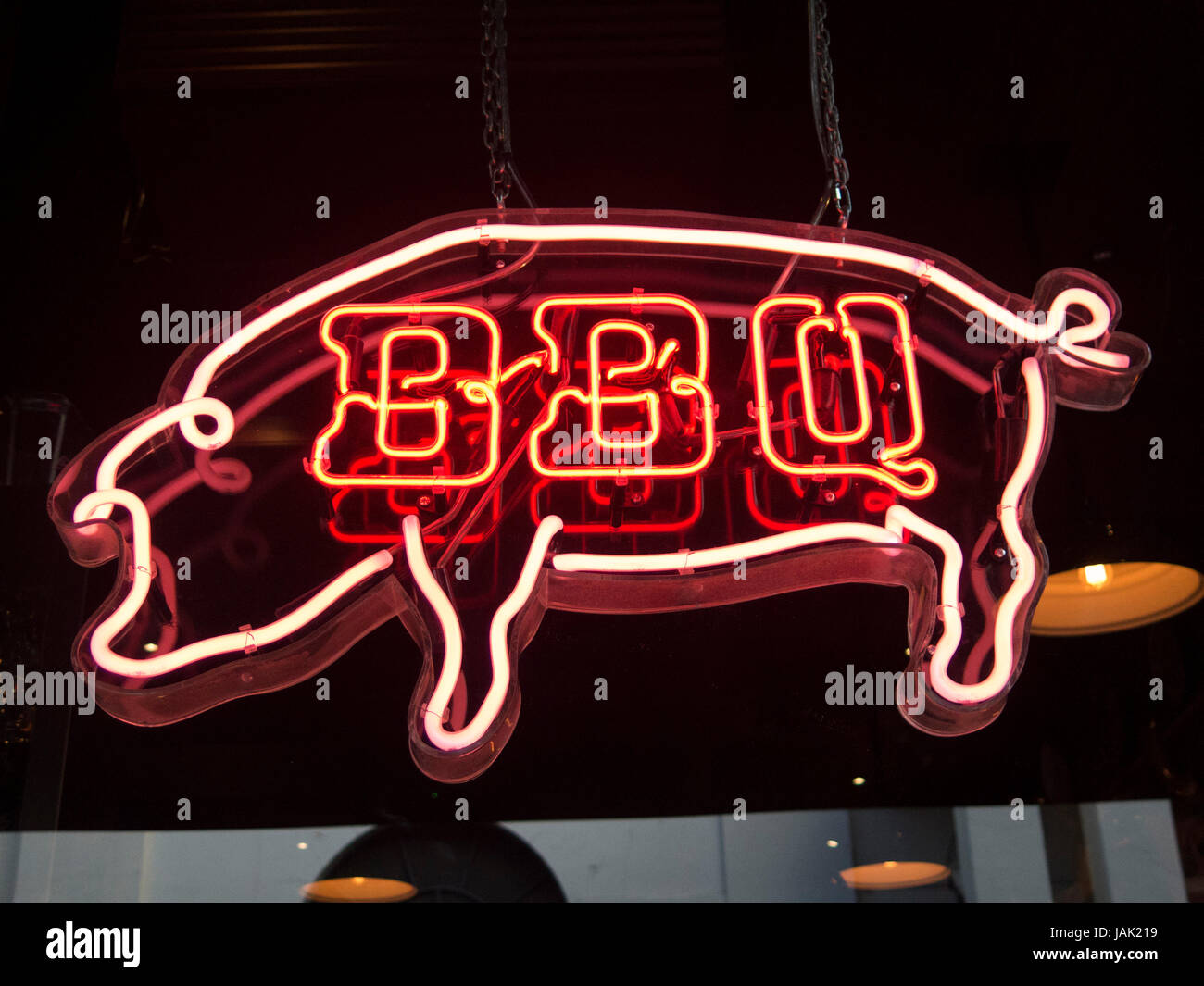 Neon BBQ sign shaped as Pig in window of Bodean's BBQ; Covent Garden Stock Photo