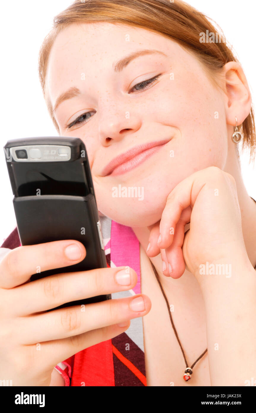 Teenager-Mädchen telefoniert mit Mobiltelefon vor weißem Hintergrund. Stock Photo