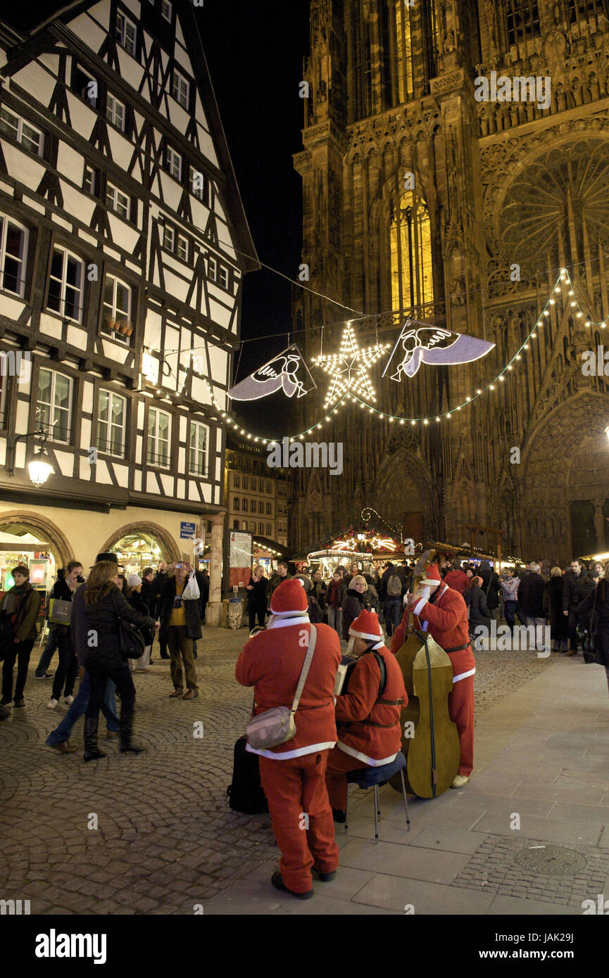 Europe,France,Alsace,Strasbourg,musician as a Weihnachtsmänner panels in the Rue Merciere, Stock Photo