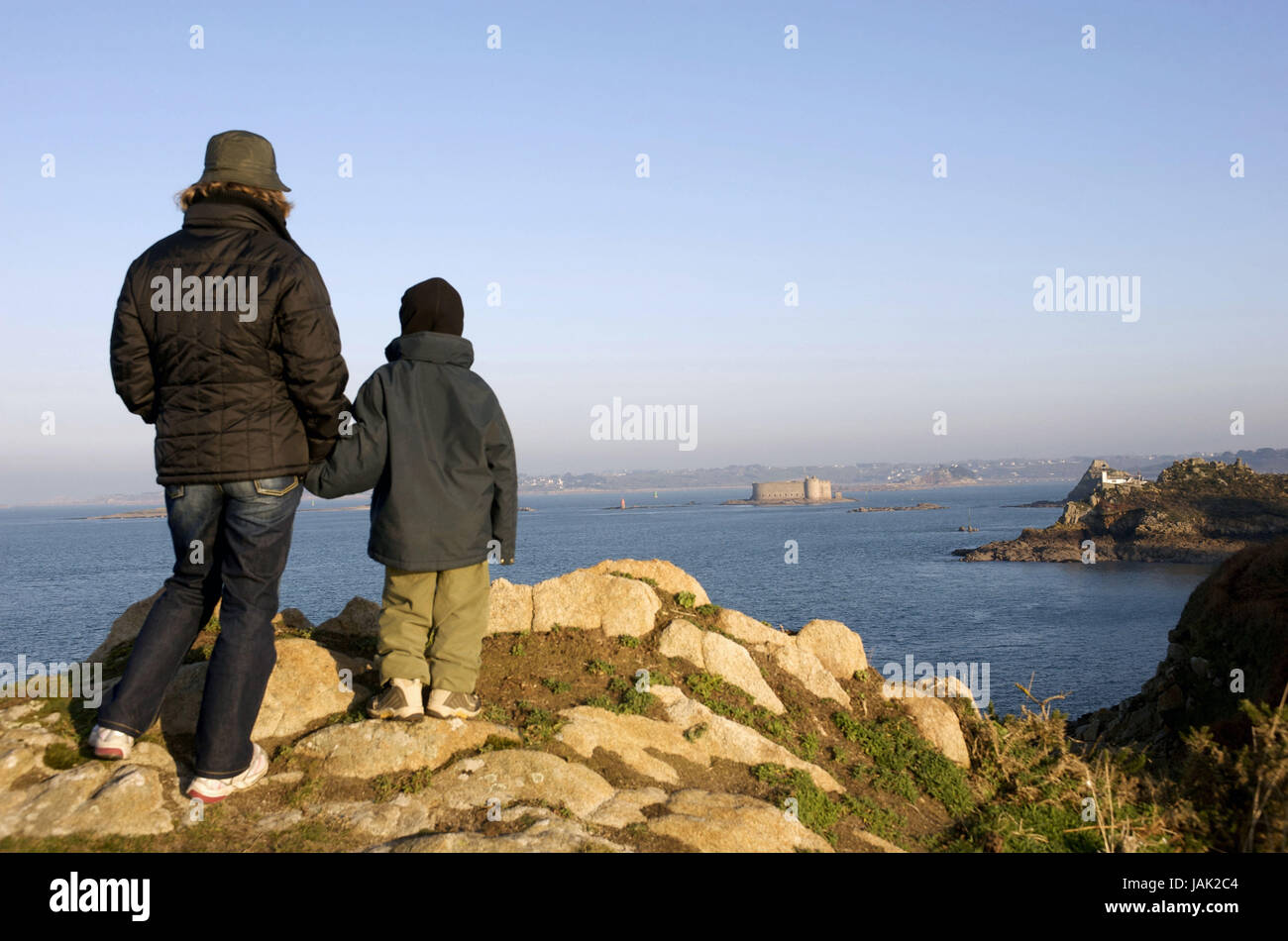 Europe,France,Brittany,Finistere,Carantec,Ile Louet,mother and child look at the Chateau you Taureau, Stock Photo