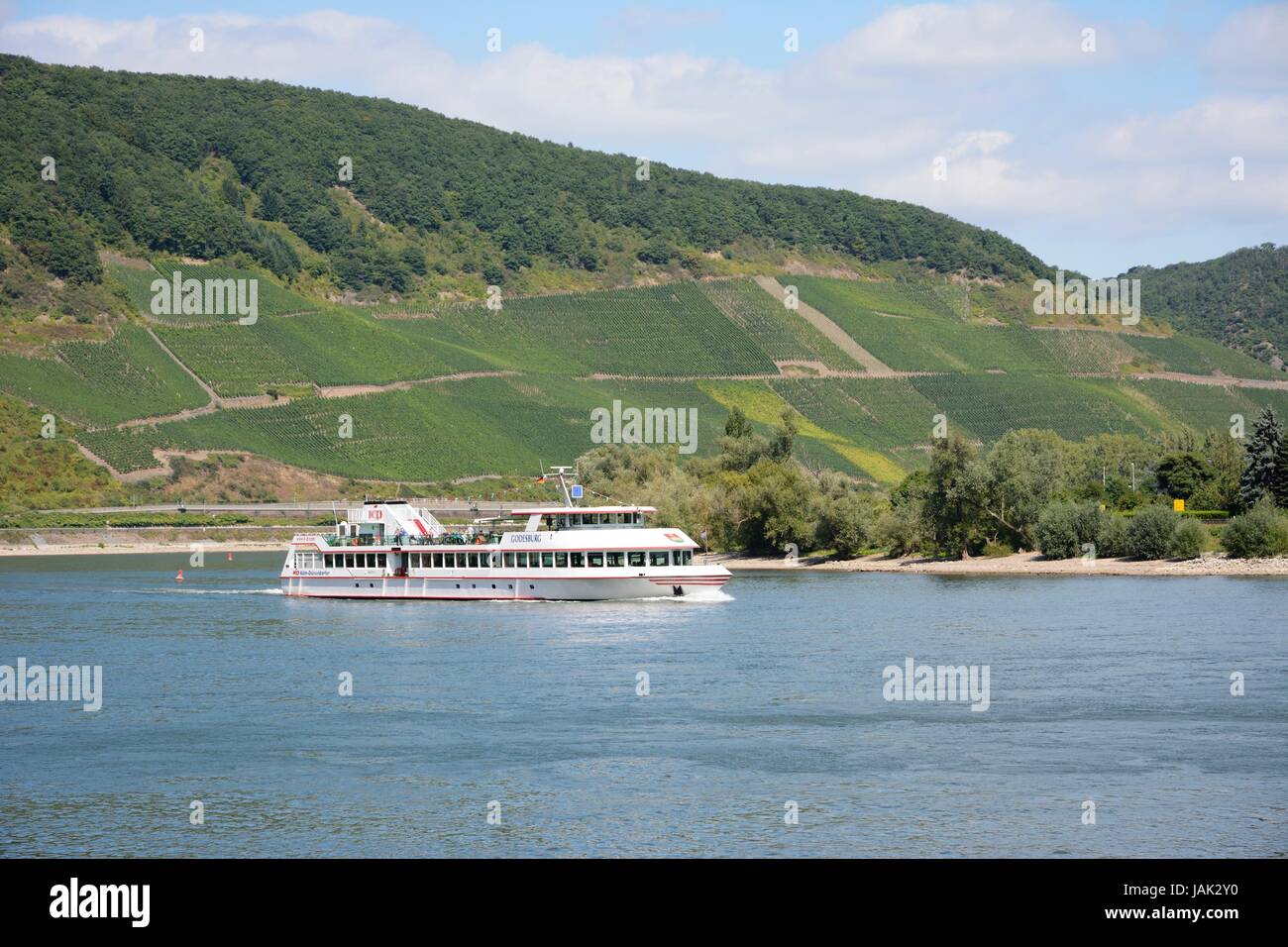 BOPPARD, GERMANY - SEPTEMBER 2: Tourists making a ship round trip on the river Rhein in Boppard, Germany on September 2, 2013. The ship Godesburg belongs to the KD river cruise company founded in 1853. Foto taken from the Rheinalle with view accross the river. Stock Photo
