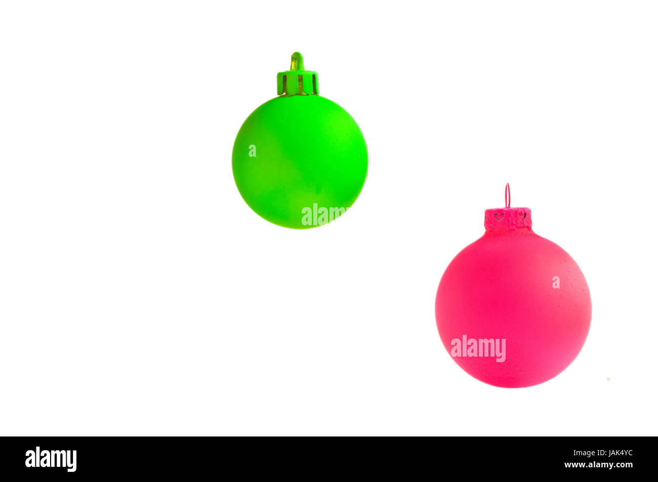 neongrüne, neongelbe, neonpinke Weihnachtskugel freigestellt, auf weißem Hintergrund Stock Photo