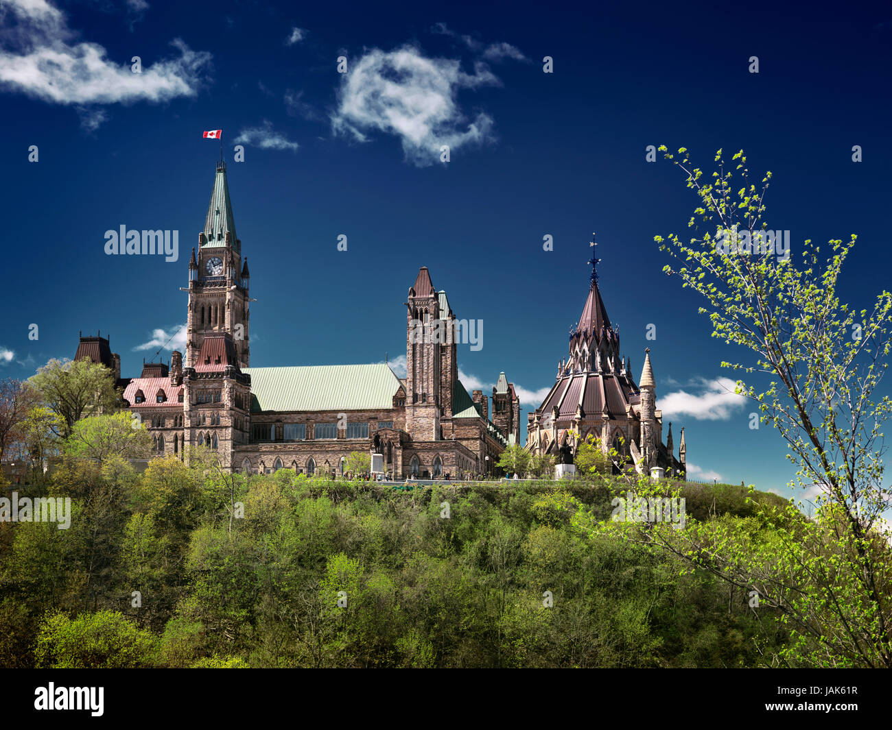 License available at MaximImages.com - The Parliament Hill Buildings and Ottawa river in Ottawa, Ontario, Canada on a sunny springtime day Stock Photo