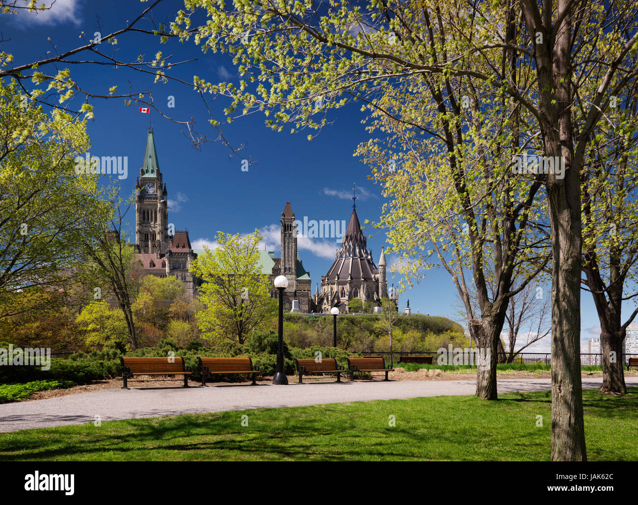 License available at MaximImages.com - The Parliament Hill Buildings and Ottawa river in Ottawa, Ontario, Canada on a sunny springtime day Stock Photo