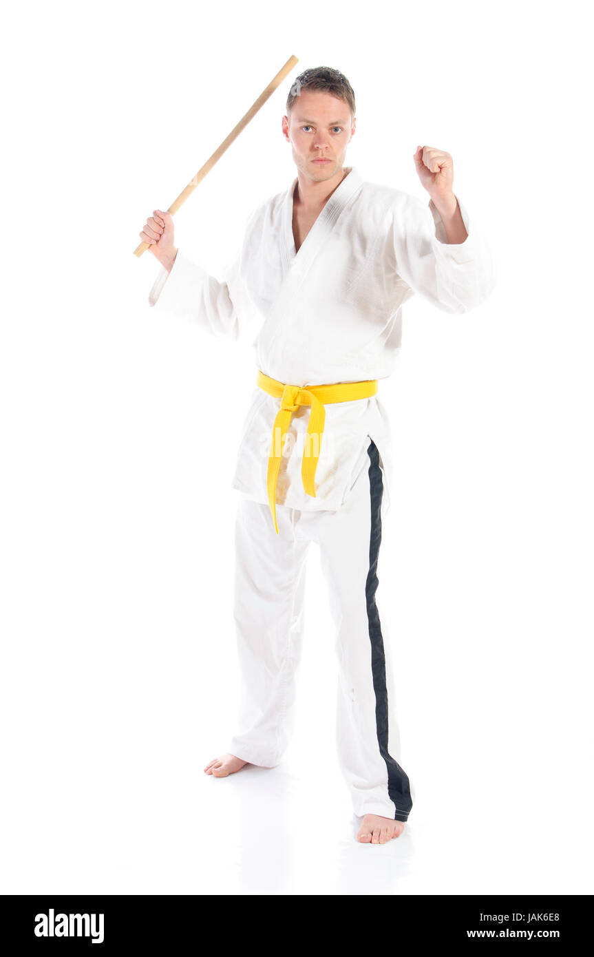 Mann macht Jiu Jitsu Kampfsport Übungen in typischem weißer Anzug, freigestellt vor weißem Hintergrund. Stock Photo