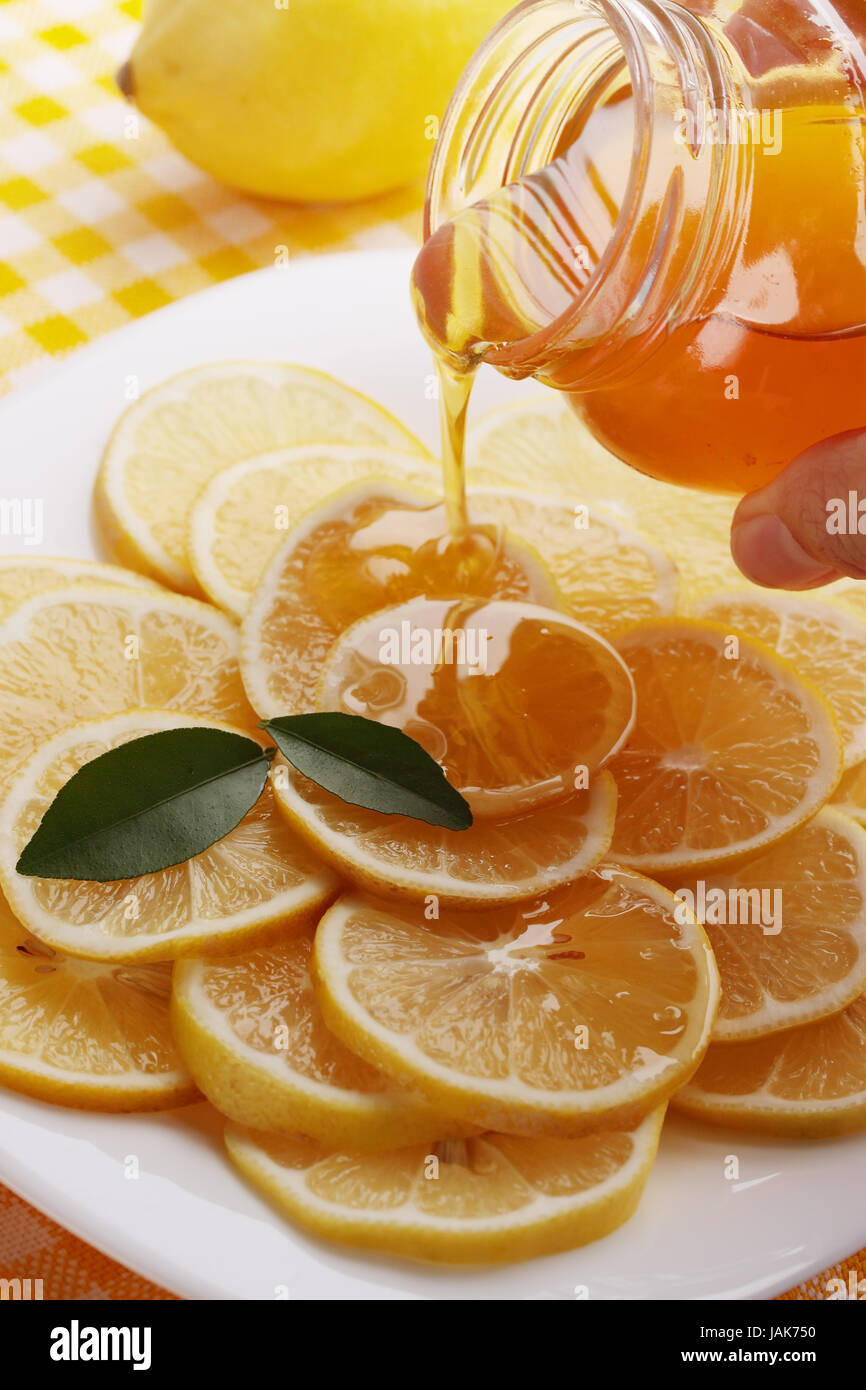 pour honey lemon slices on a plate Stock Photo - Alamy