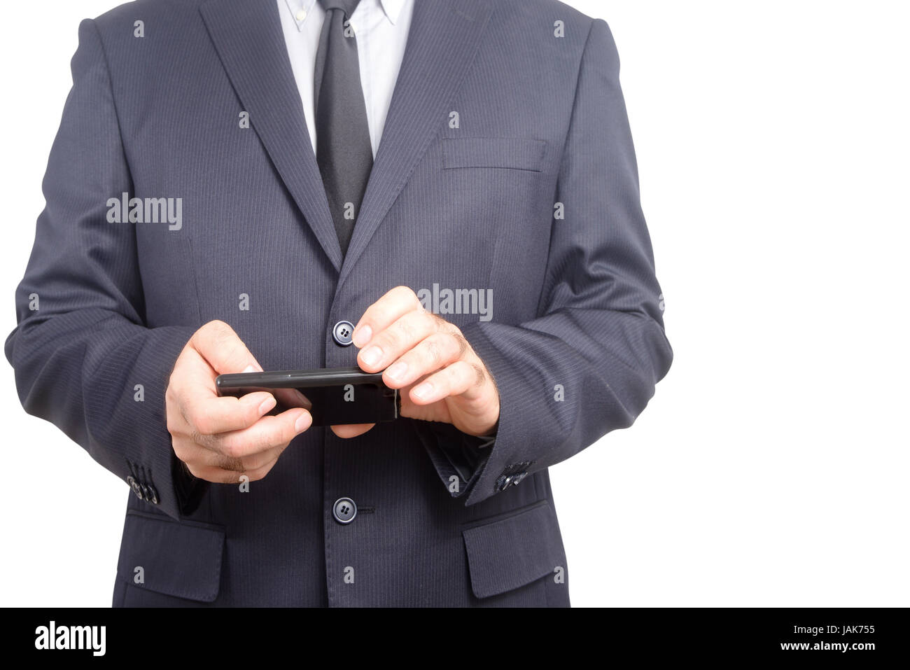 Businessman consulting his agenda on his intelligent electronic device Stock Photo