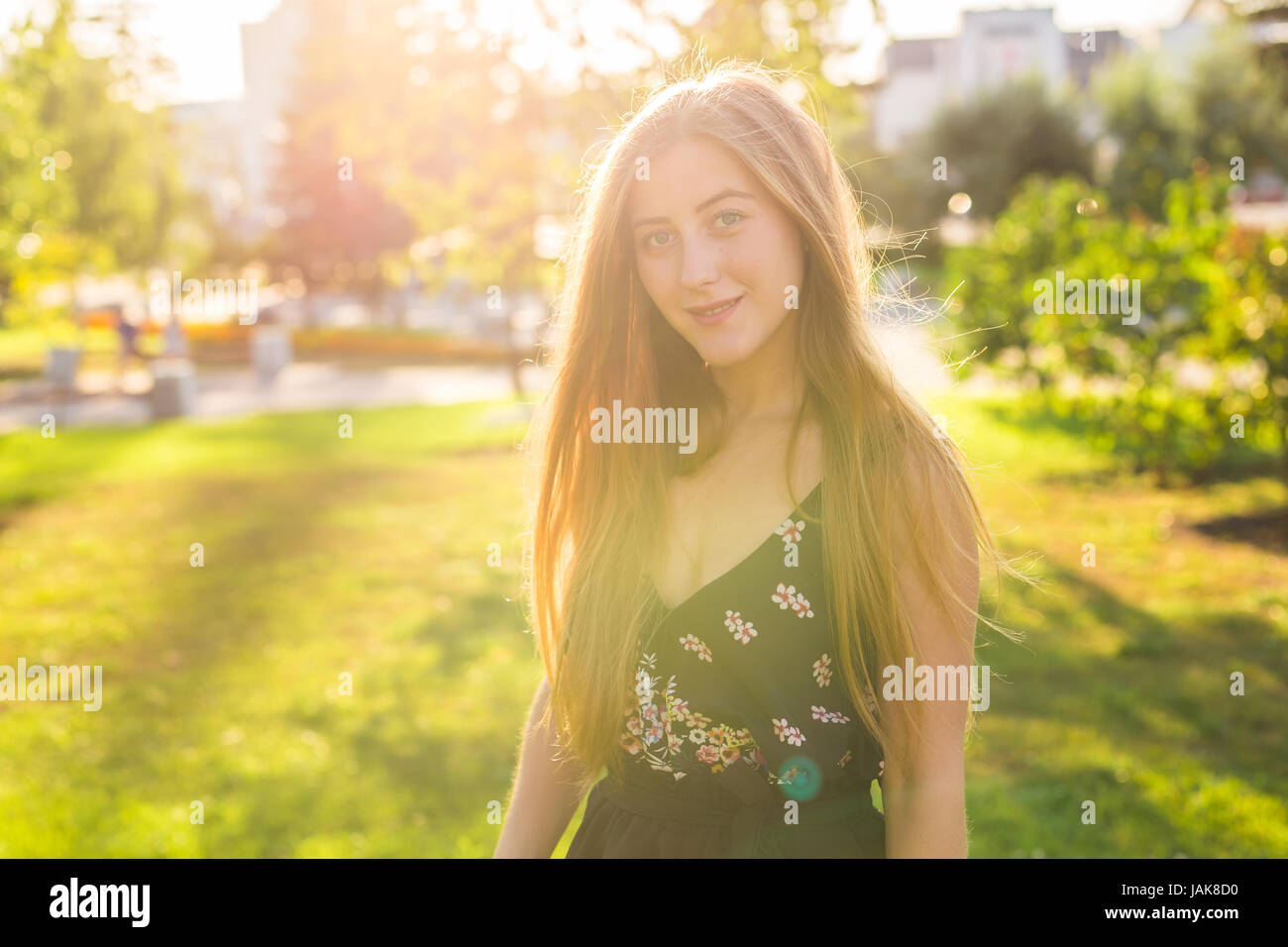 Beautiful young woman in the park. Outdoor portrait Stock Photo - Alamy