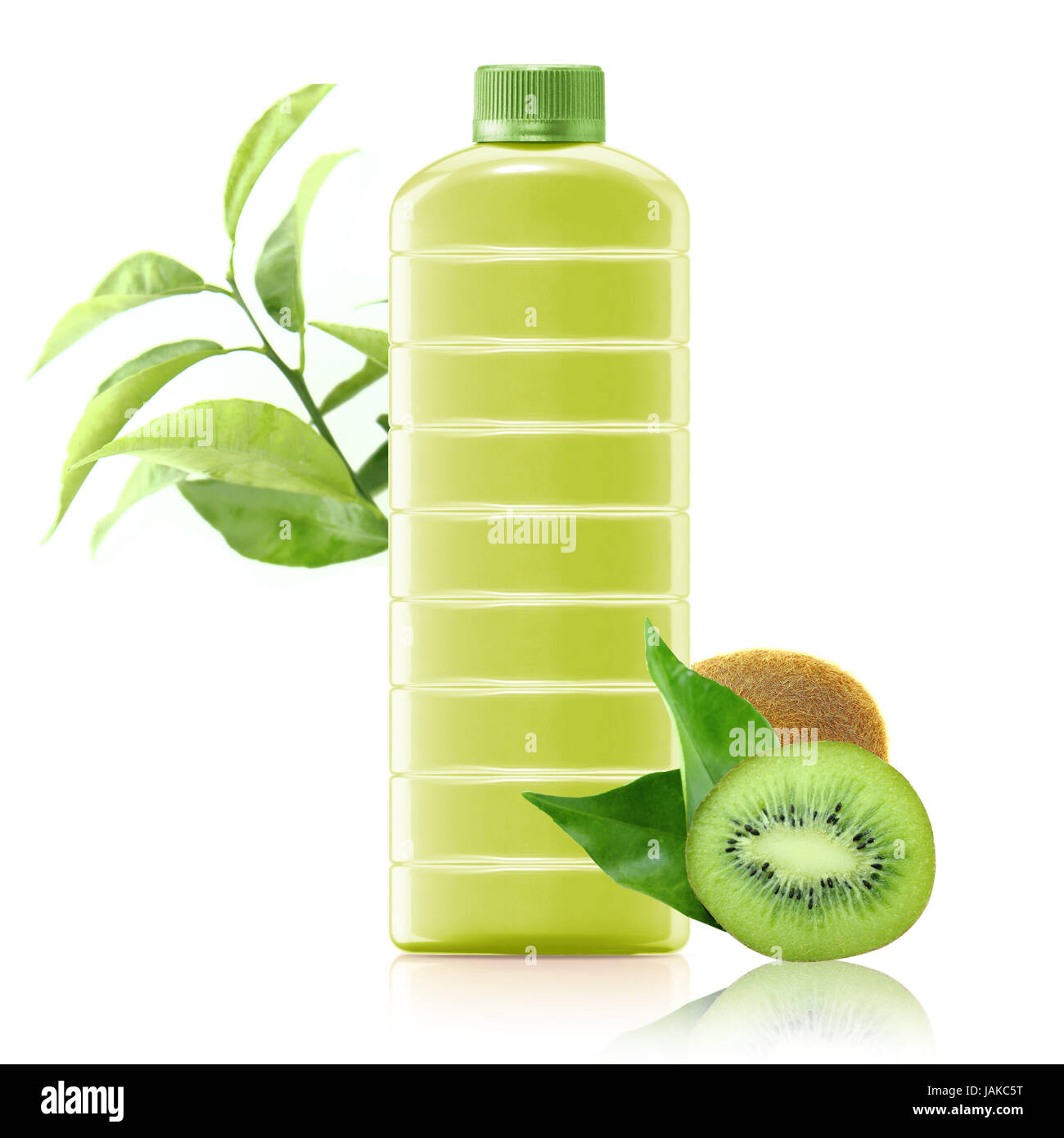 kiwi juice in a plastic container jug with fresh kiwi and leaves on a white background. Stock Photo