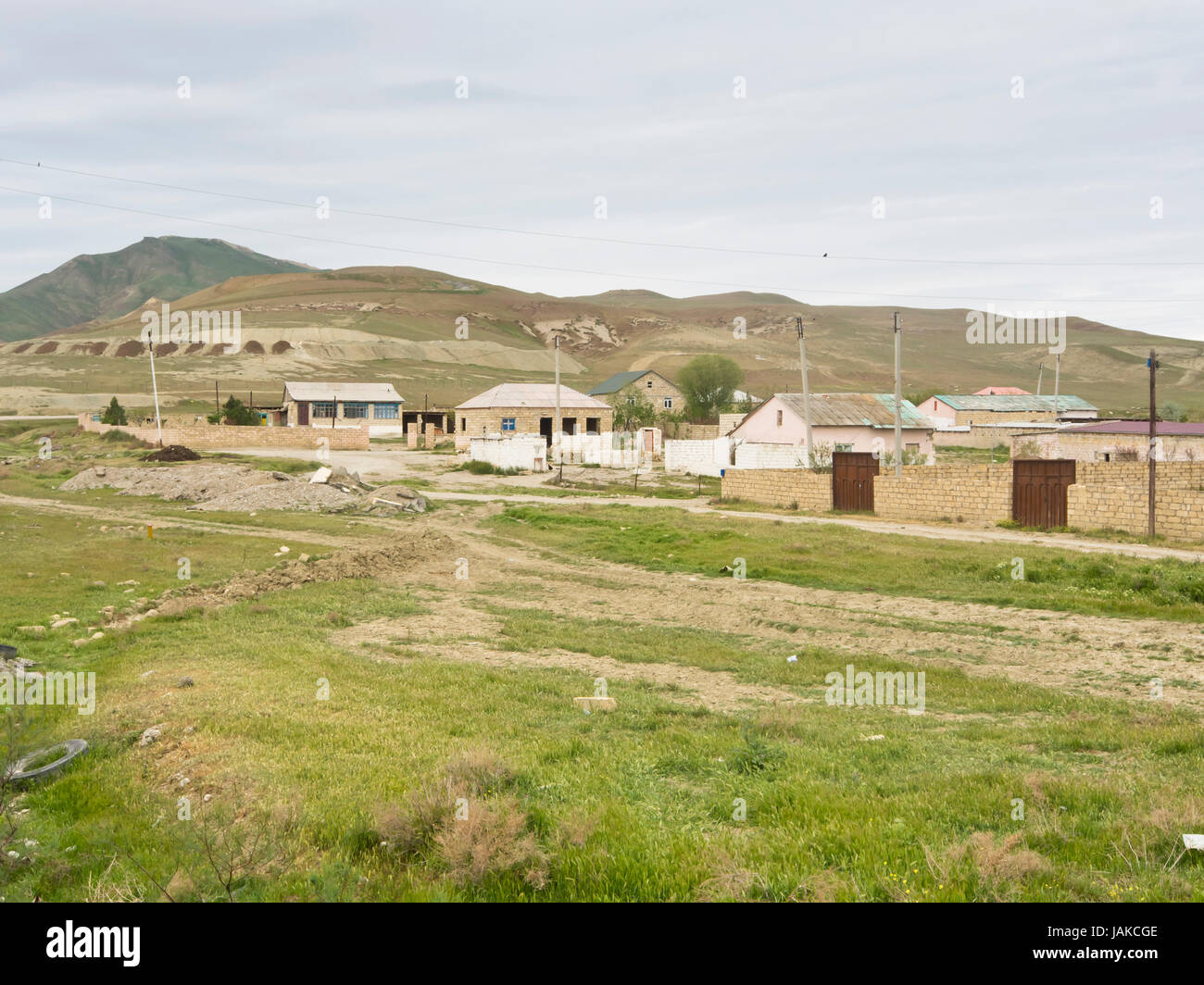 Houses and homes near the village of Jangi (  Cəngi ) one hour west of Baku in Azerbaijan, concrete and sandstone buildings in an open landscape Stock Photo
