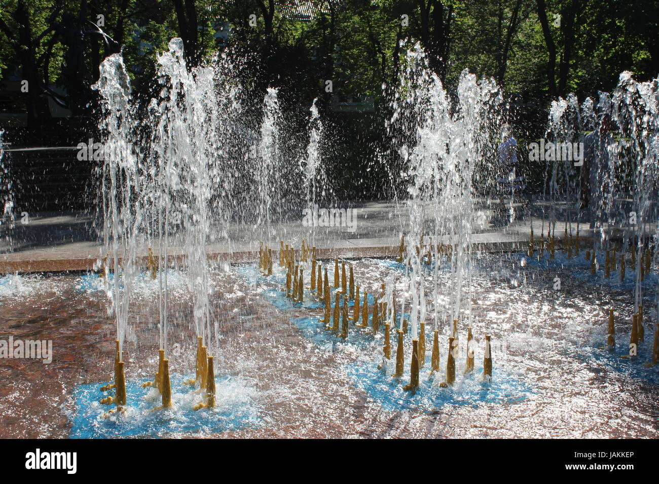 nice fountains in city park with big water jet Stock Photo - Alamy