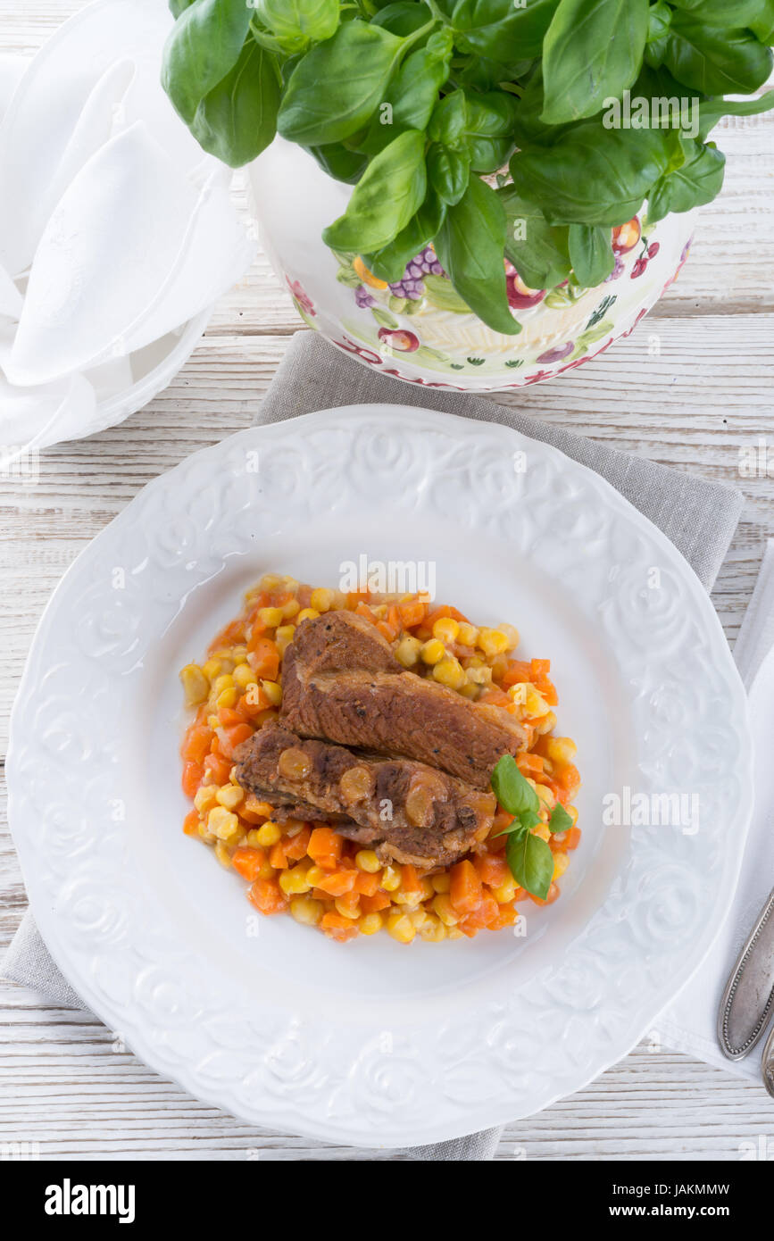 ribs with carrots and maize Stock Photo