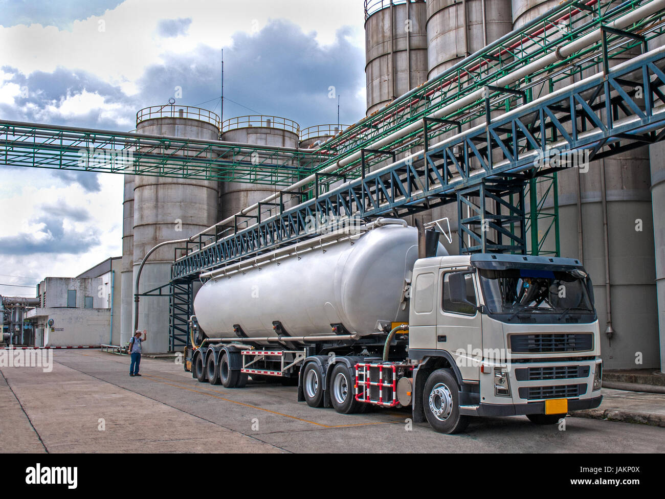 Tanker, Truck Delivery Danger Chemical in Petrochemical Plant in Asia Stock Photo