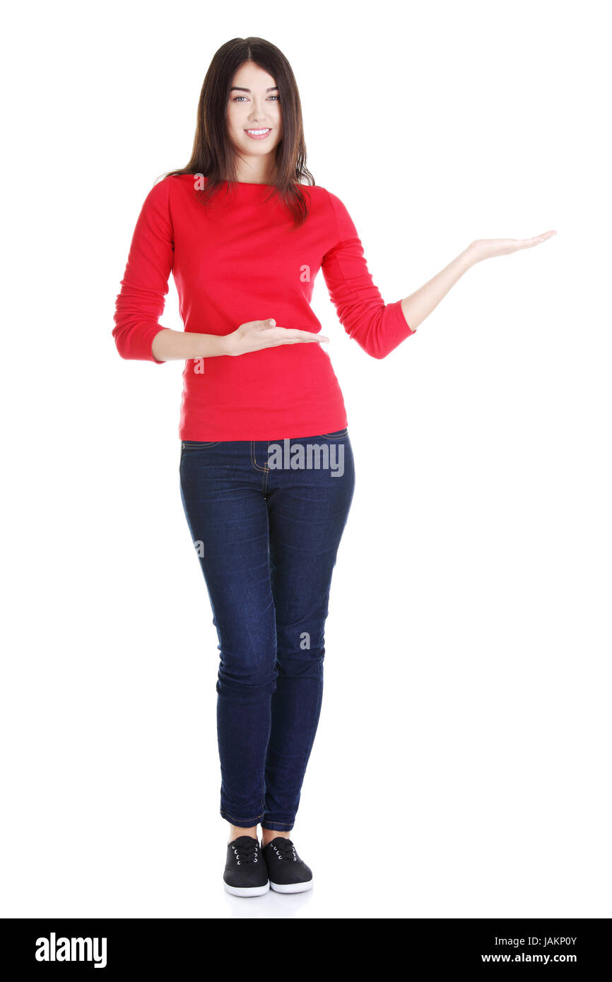 Happy , excited young woman showing copy space, isolated on white Stock ...