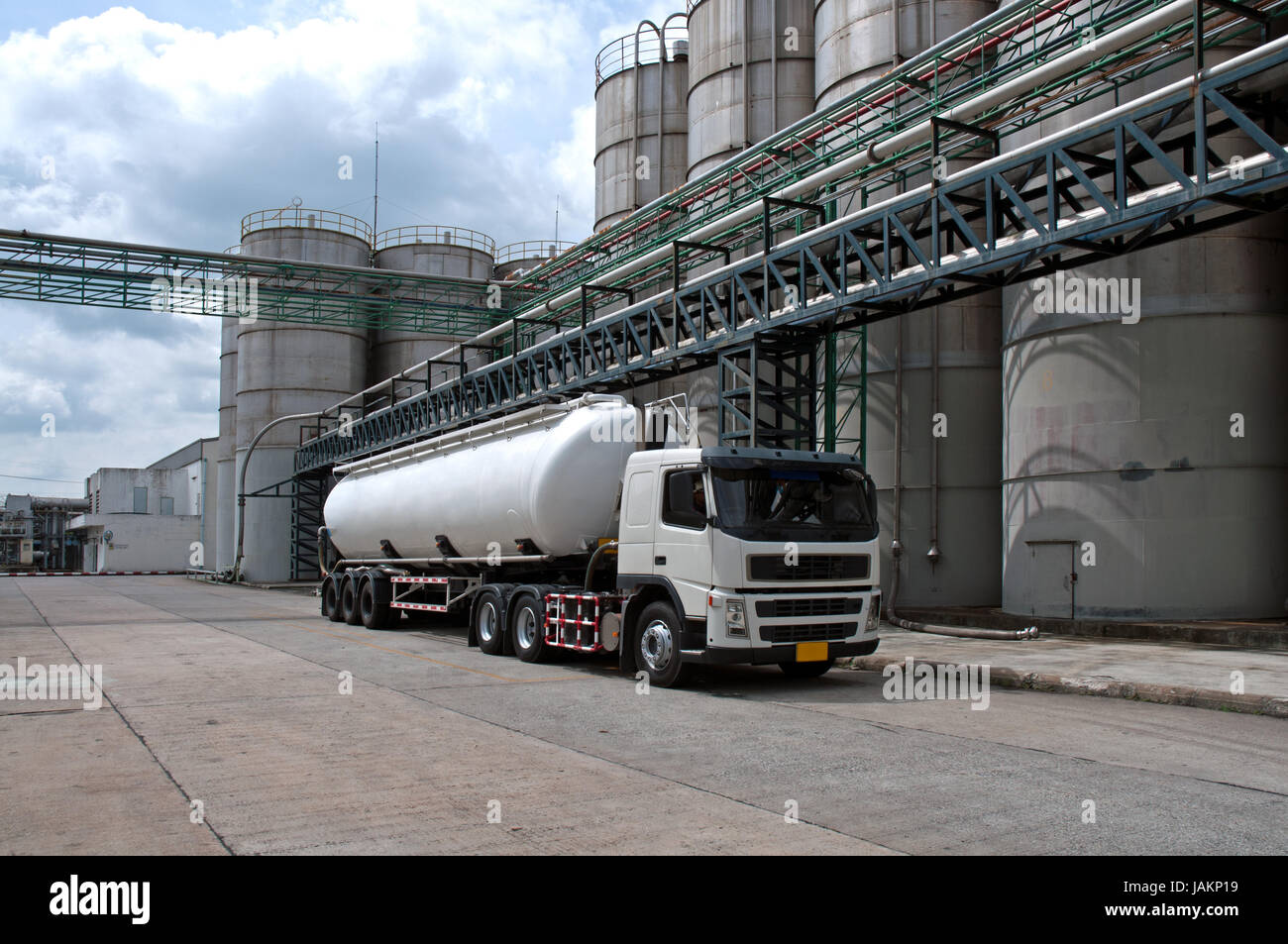 Tanker, Truck Delivery Danger Chemical in Petrochemical Plant in Asia Stock Photo