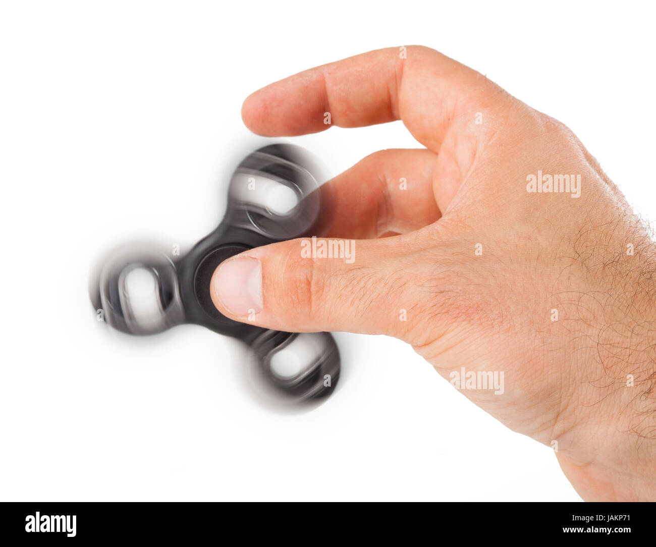Palying with a Black Fidget Spinner isolated on white background Stock ...