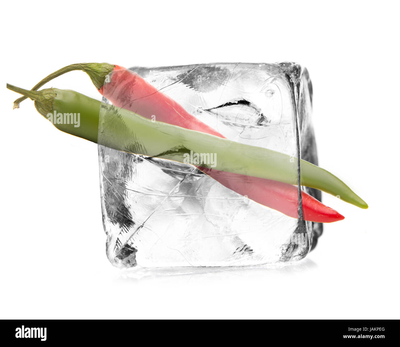 Peperoni in einem Eiswürfel freigestellt, isoliert mit weißem Hintergrund Stock Photo