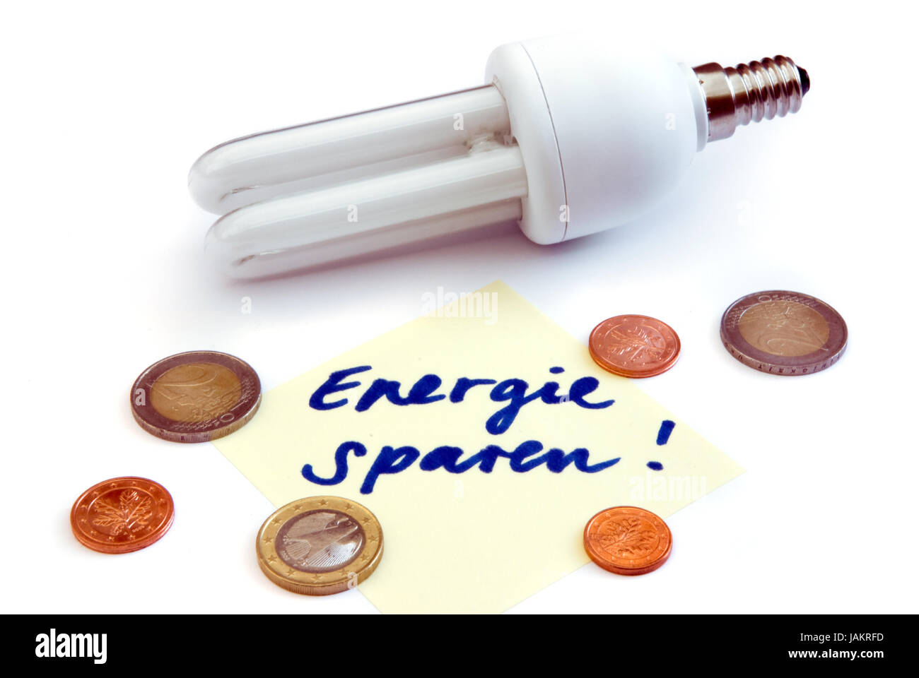 isolated energy saving lamp and euro money Stock Photo