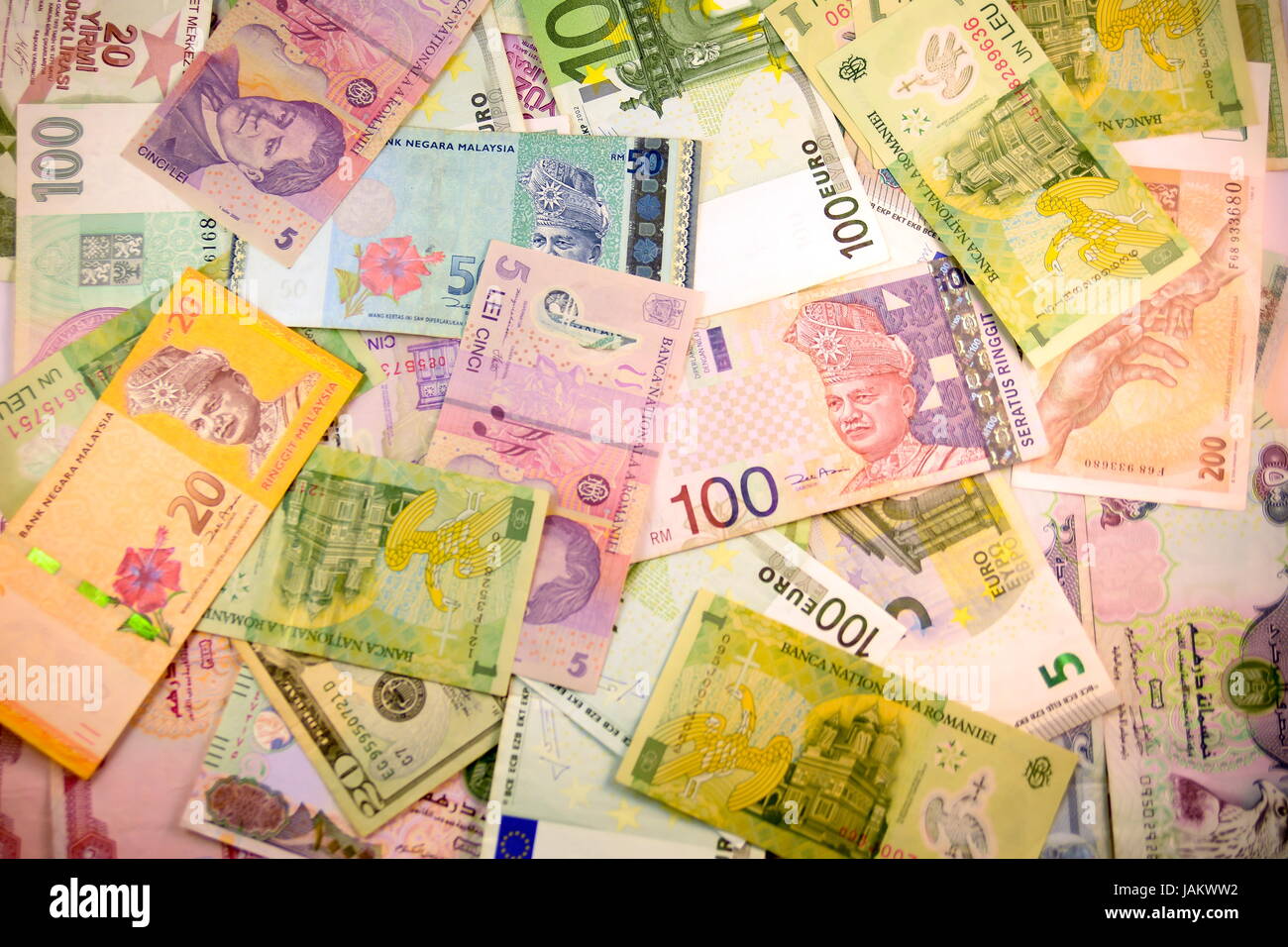 Different currency note and coins from different countries background ...