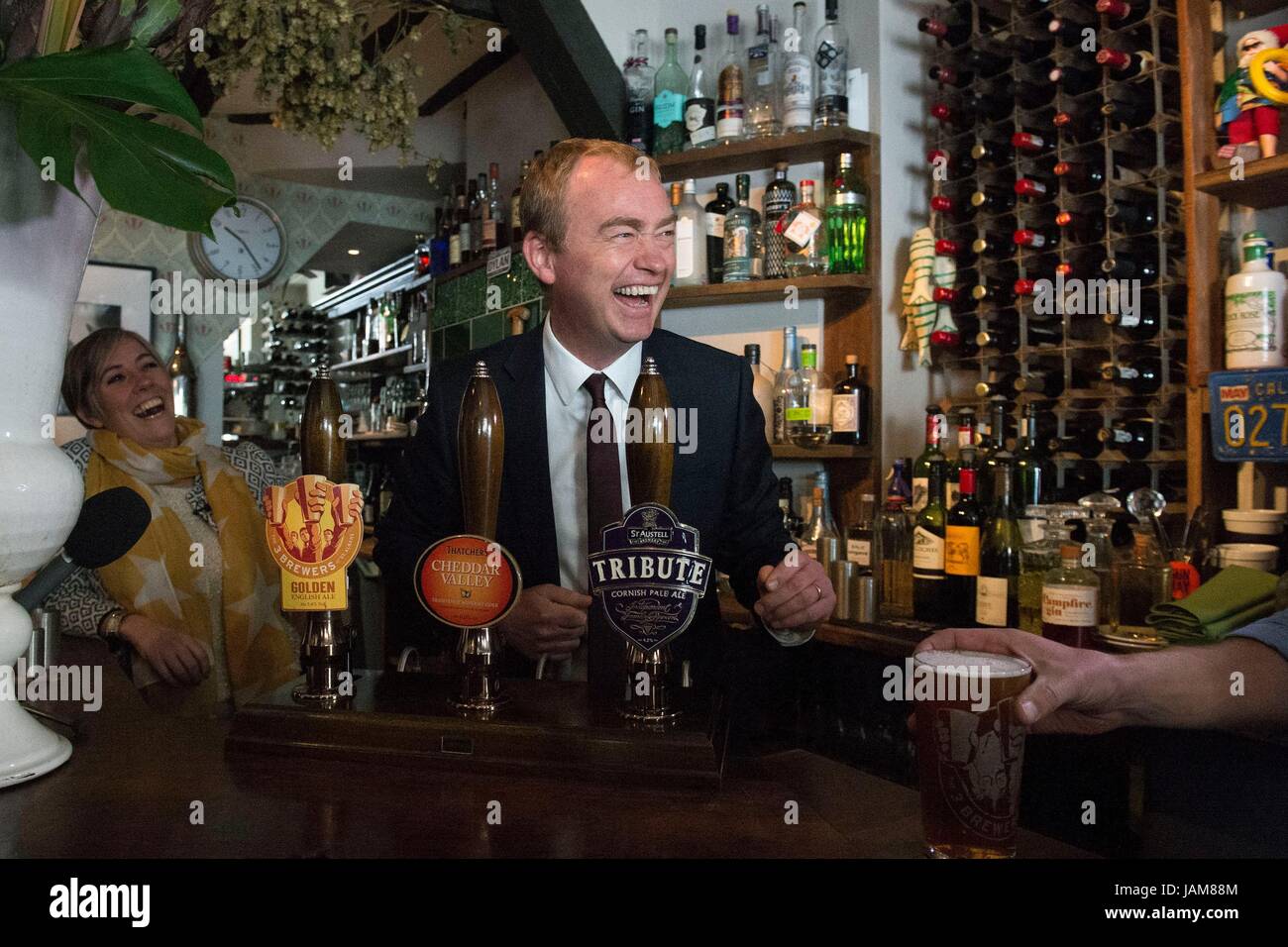 Liberal Democrats leader Tim Farron pulls a pint during a visit to Dylans The King Arms pub in St Albans, while on the General Election campaign trail. Stock Photo