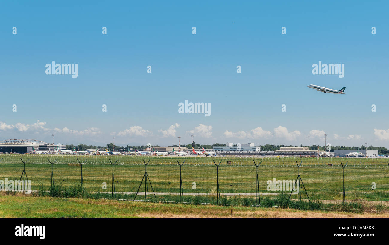 Alitalia commercial airplane takes off from Milan's Linate Airport in Italy Stock Photo