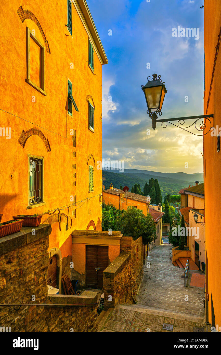 Castagneto Carducci old stone village in Maremma on sunset. Picturesque flowery street and traditional houses. Tuscany, Italy Europe. Stock Photo