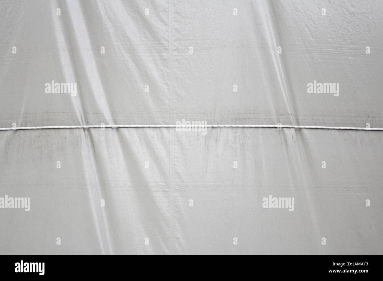 Curtain holding crumpled rope, fabric and protection Stock Photo - Alamy