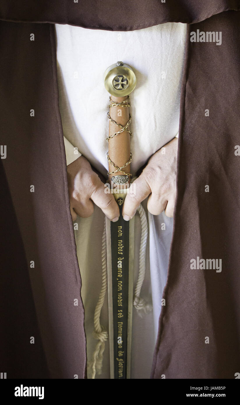 Gladiator armed with metal sword and uniform, recreation and history Stock Photo