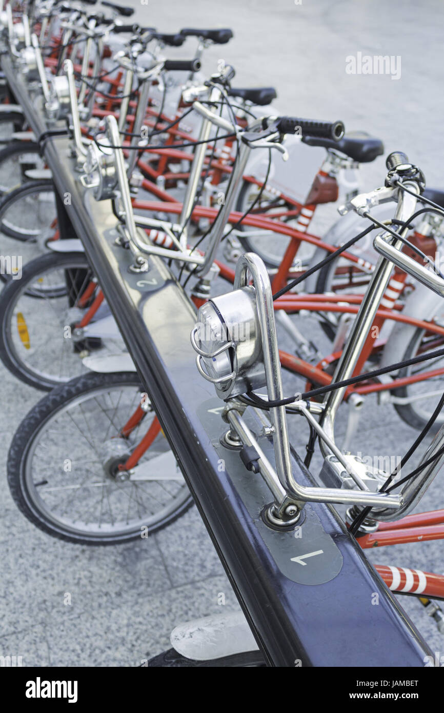 Public Bikes in the plaza parking, sports and activities Stock Photo