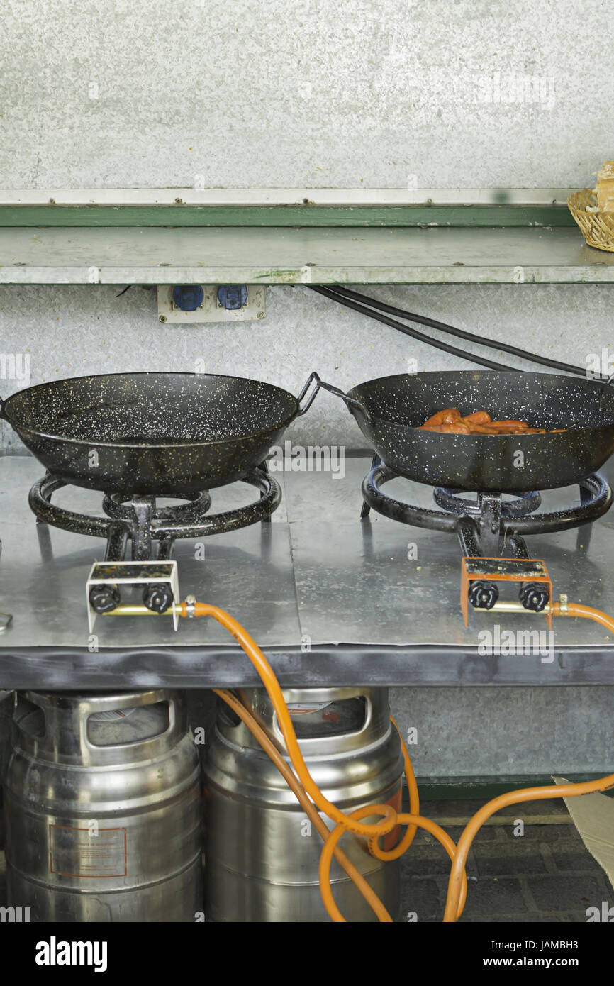 Butane Stove with sausage frying pans bar, catering Stock Photo Alamy