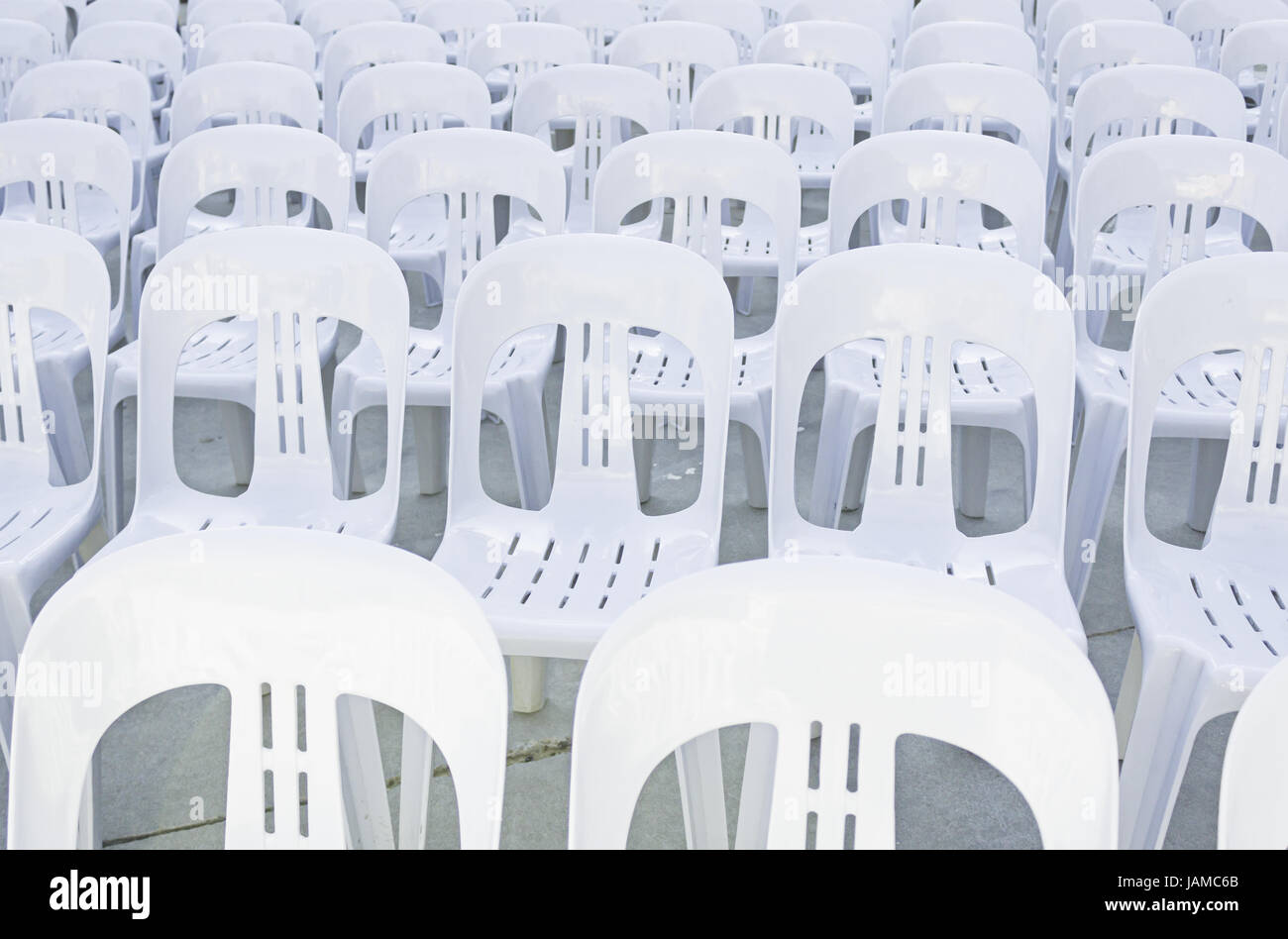 White plastic chairs in celebration and outdoor event Stock Photo Alamy