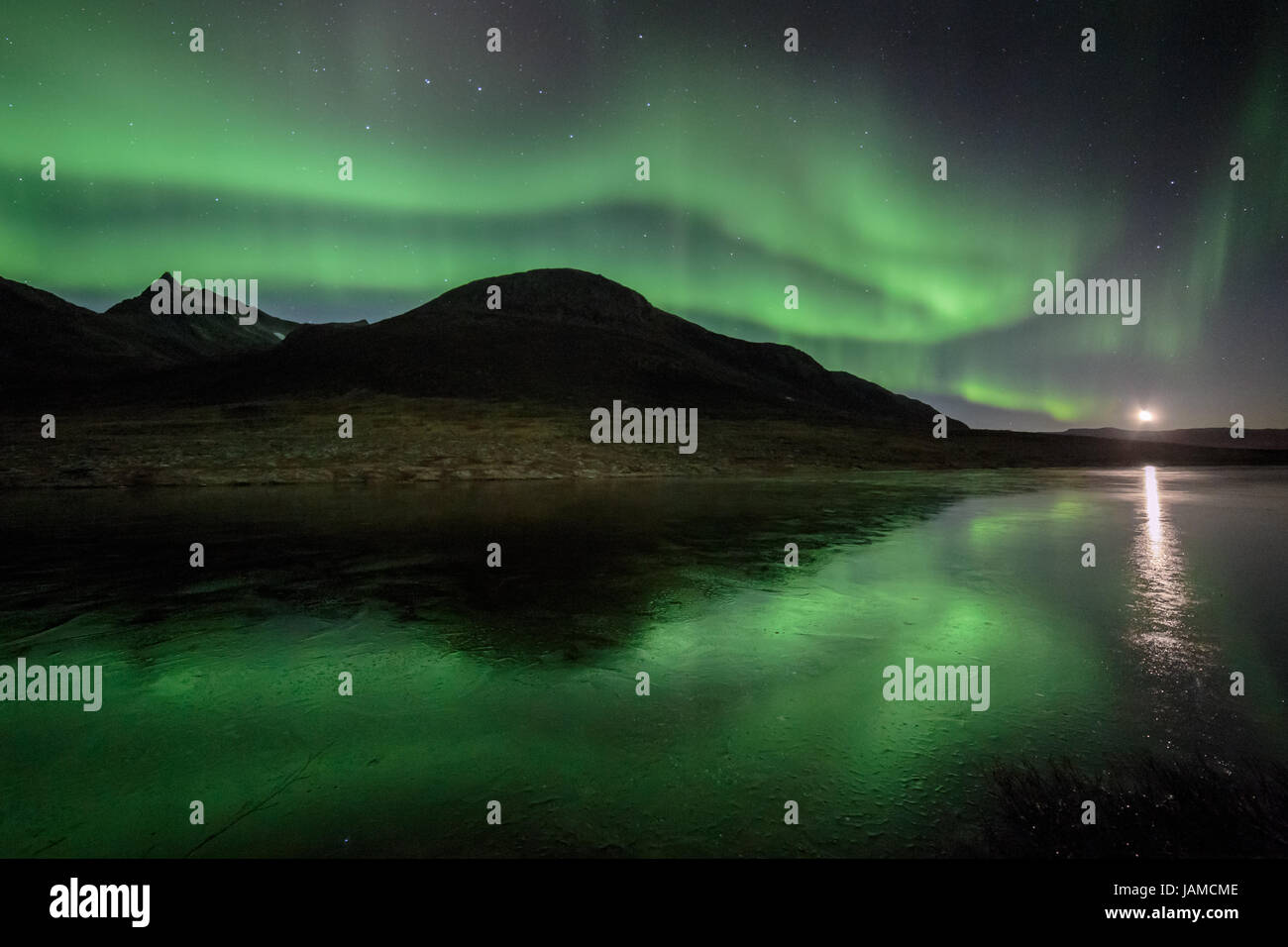 Aurora borealis or northern lights moving across night sky within the ...