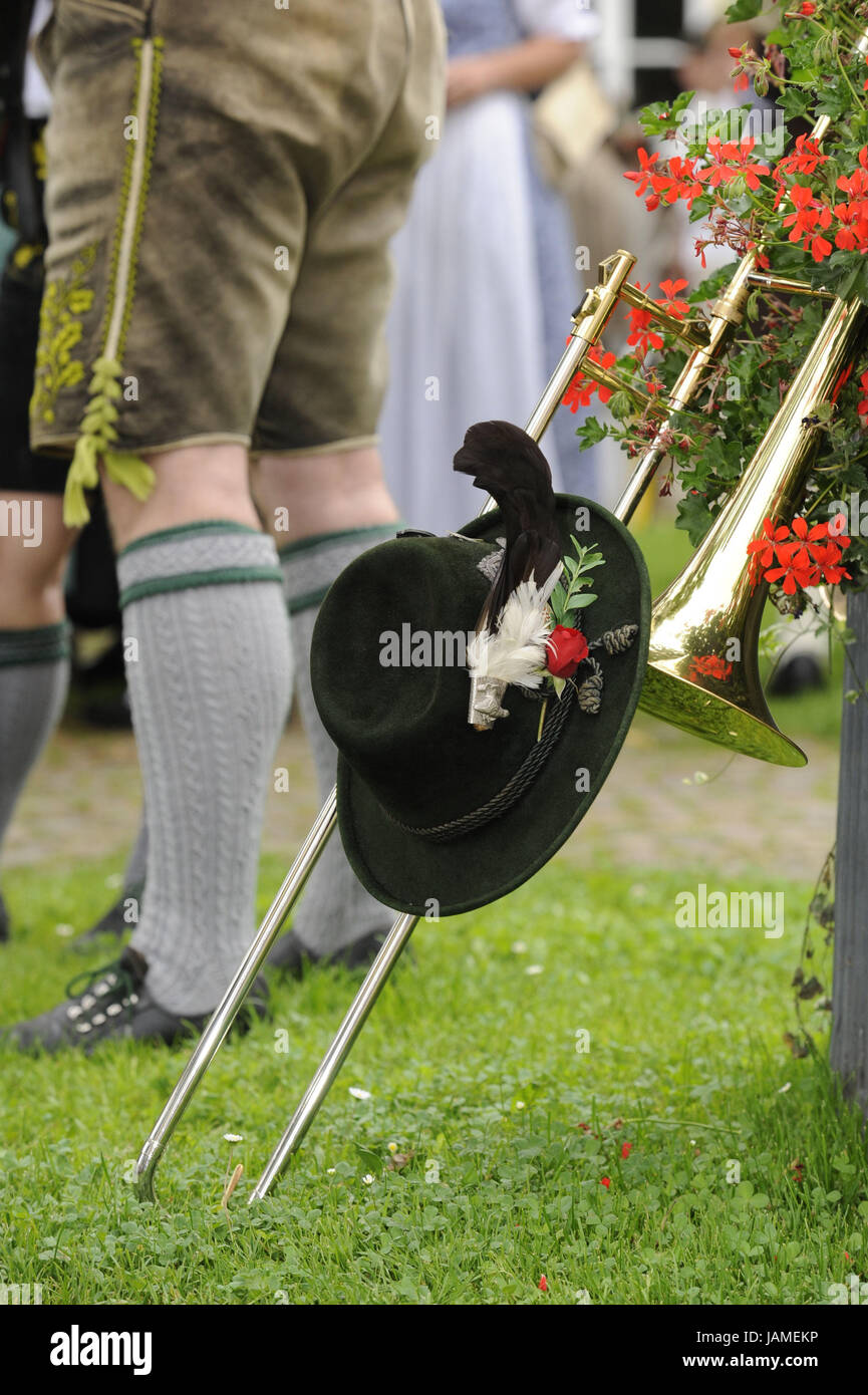 Trumpet,national costume hat,man,leather ball trousers,detail,wind instrument,instrument,care,music,music for brass instruments,in Bavarian,Bavaria,stereotype,culture,way of life,attitude to life,trombone,icon,festival with traditional costumes,typically,people,national costume, Stock Photo