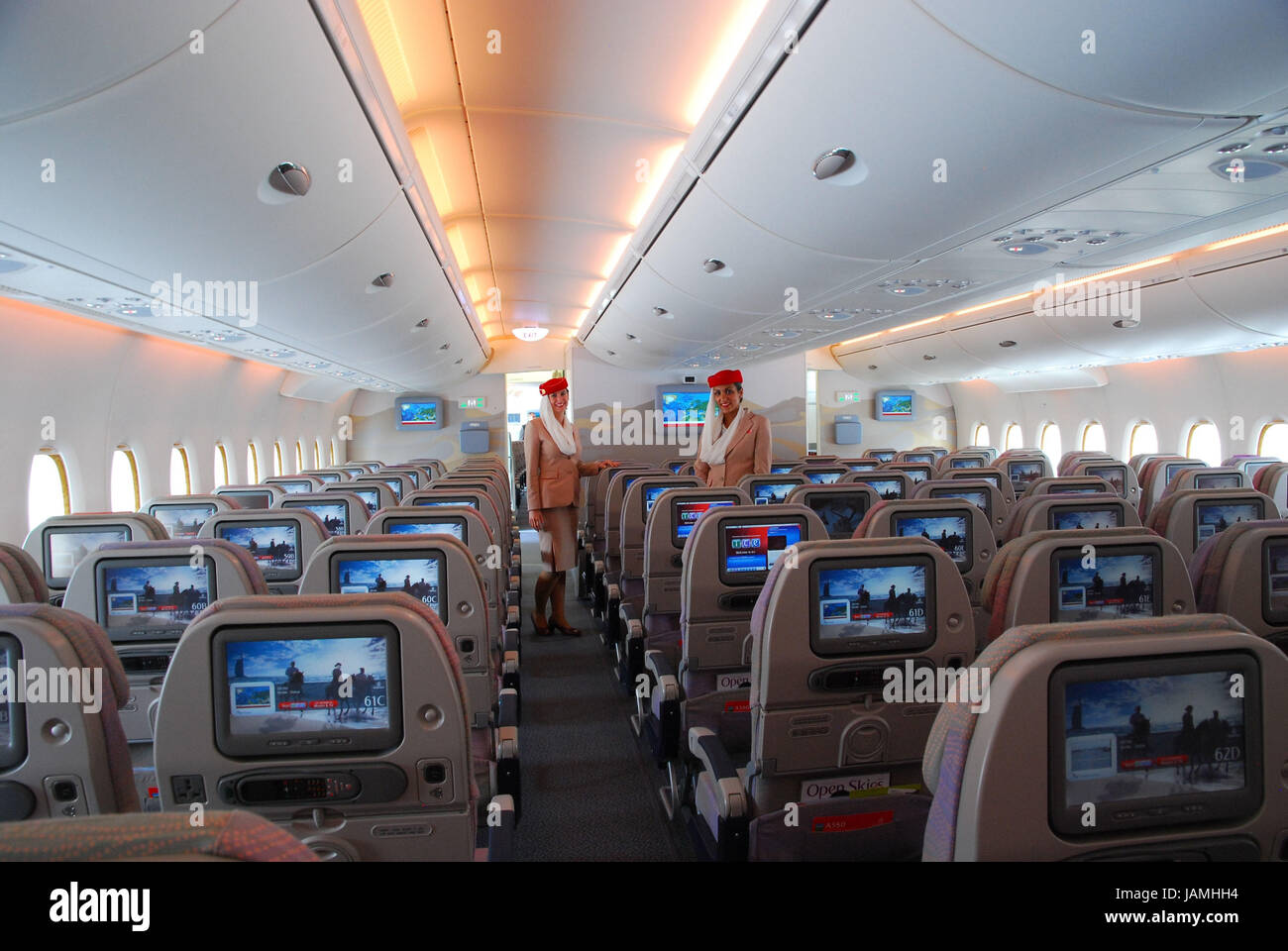 Civil aviation,air liner,airbus A380,cabin,rows,flight attendants, Stock Photo