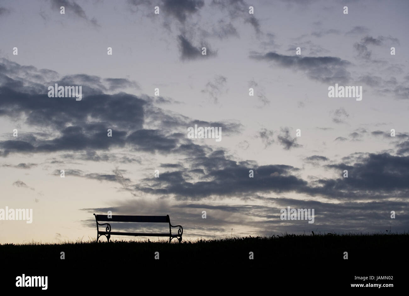 Meadow,park-bench,dusk,cloudy sky,nobody,saddle,loneliness,evening,tuning,evening tuning,sky,clouds,scenery,nature, Stock Photo