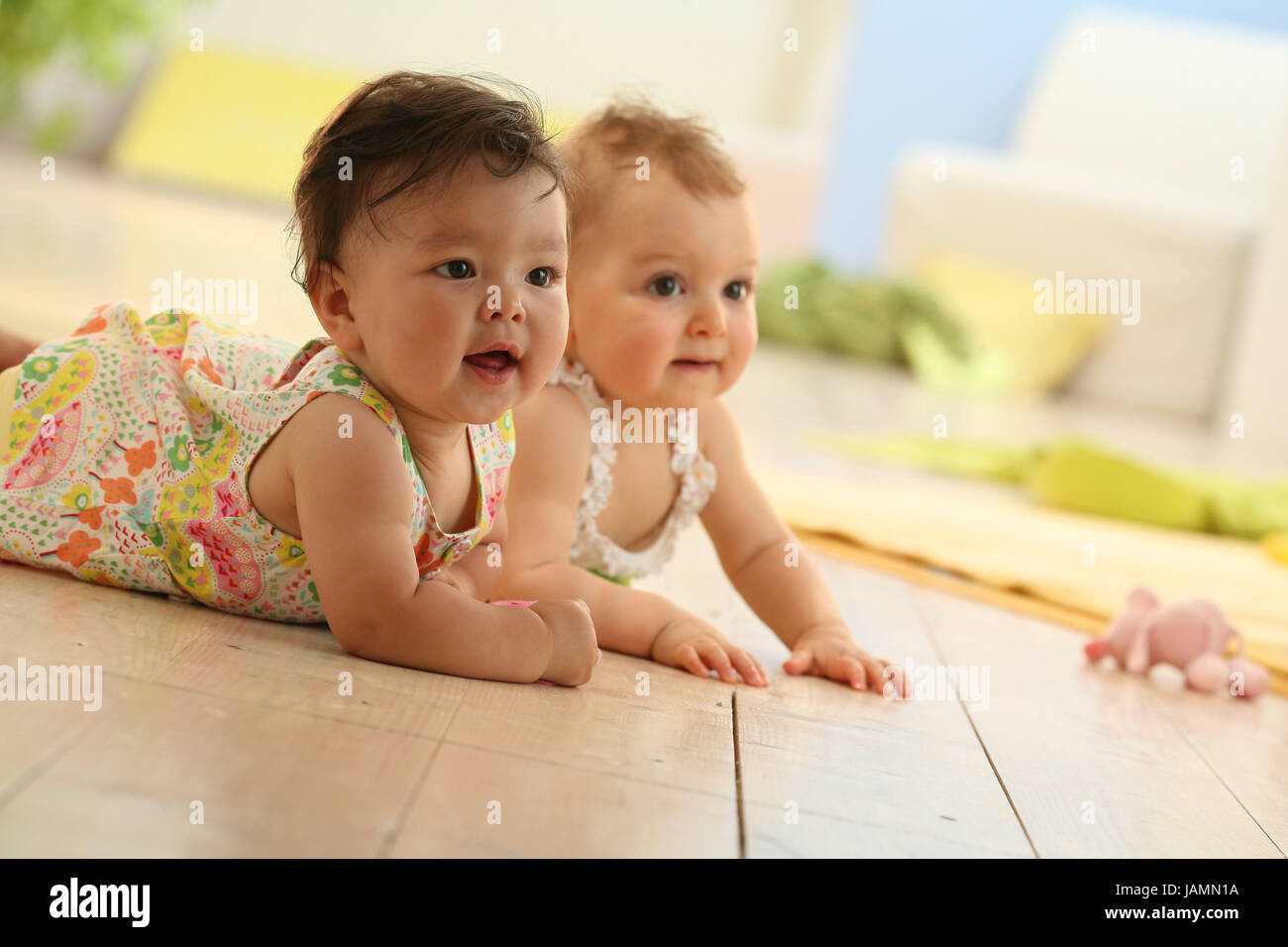 Infants,lie,observe, Stock Photo
