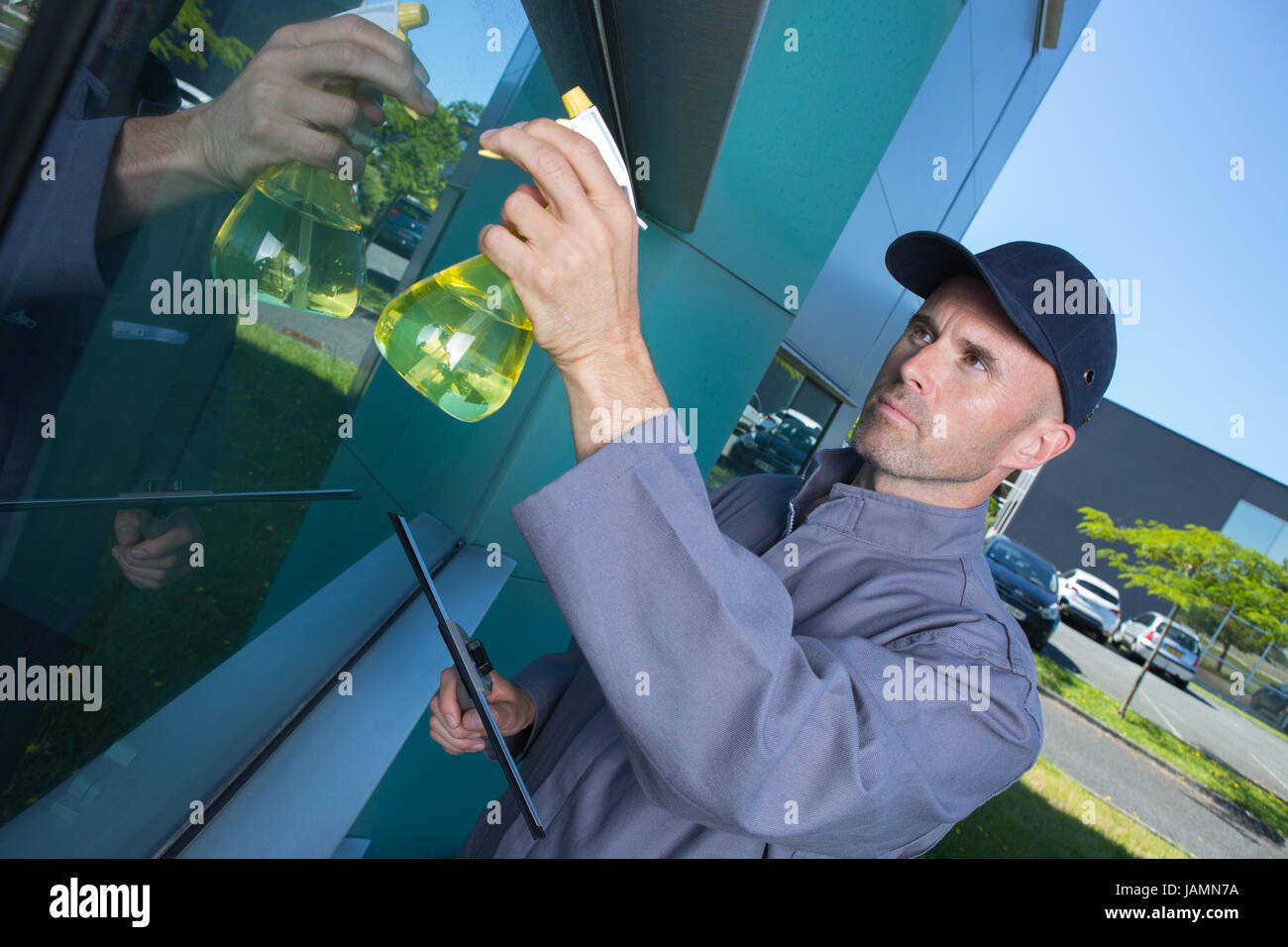 man cleaning windows Stock Photo