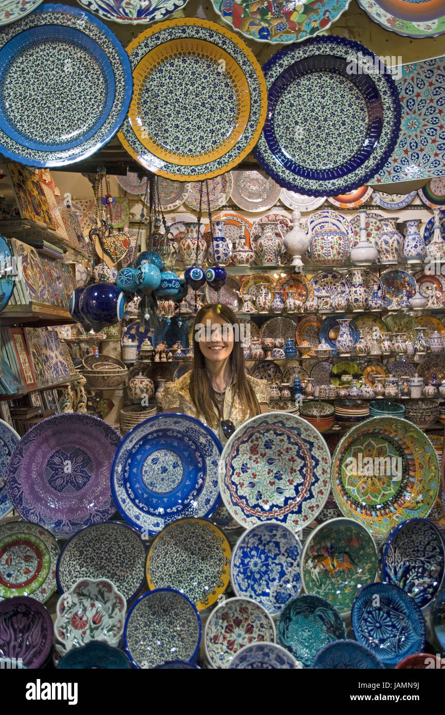 Turkey,Istanbul,Grand Bazaar,business,sales,plate,peels,differently,tourist,no model release,town,city,metropolis,port,culture,place of interest,building,bazaar,shopping street,market,person,tourist,shopping,product,offer,amount,choice,ceramics,brightly,sample,shop assistant, Stock Photo