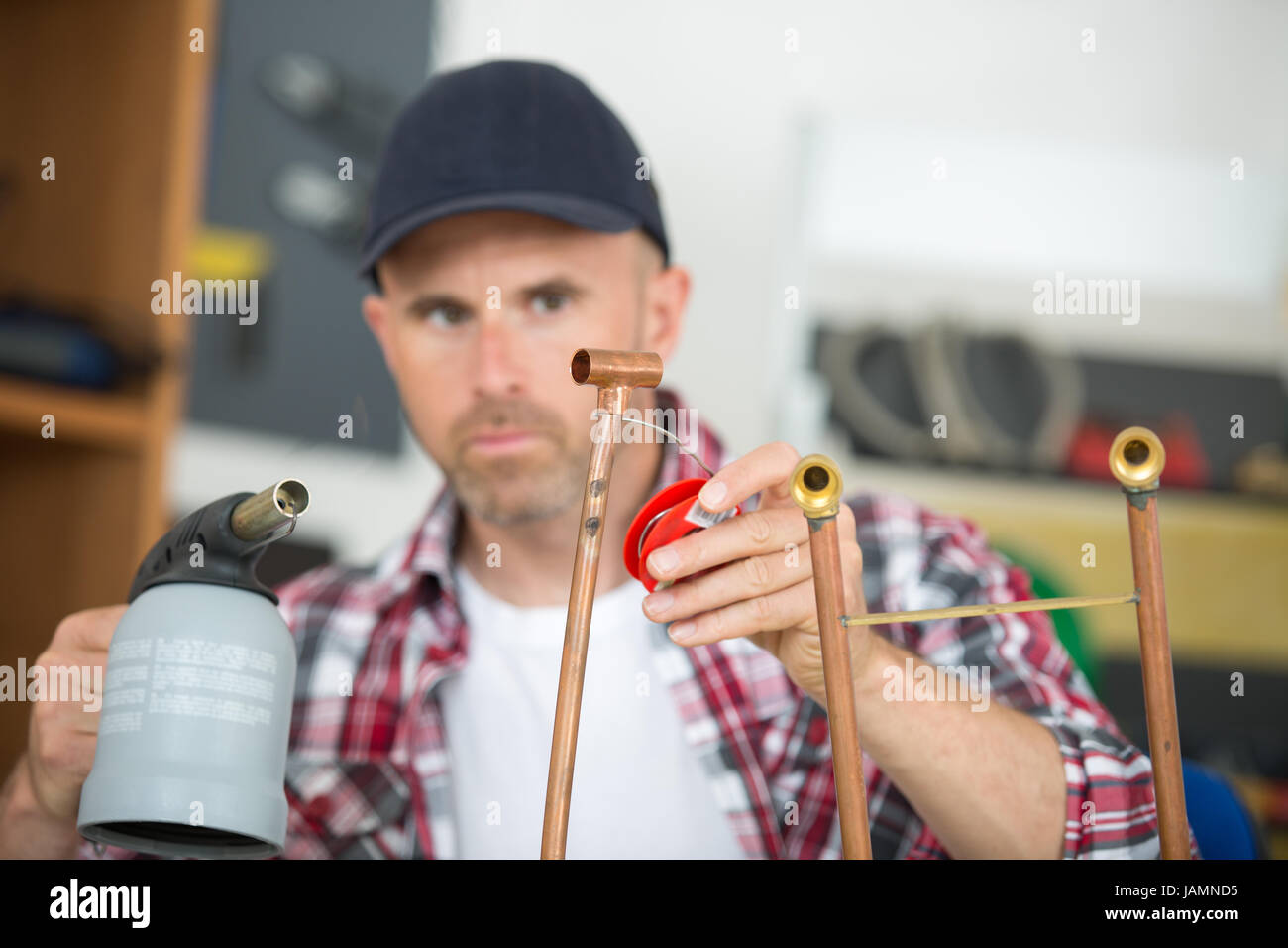 worker using blowtorch for soldering copper fittings Stock Photo Alamy