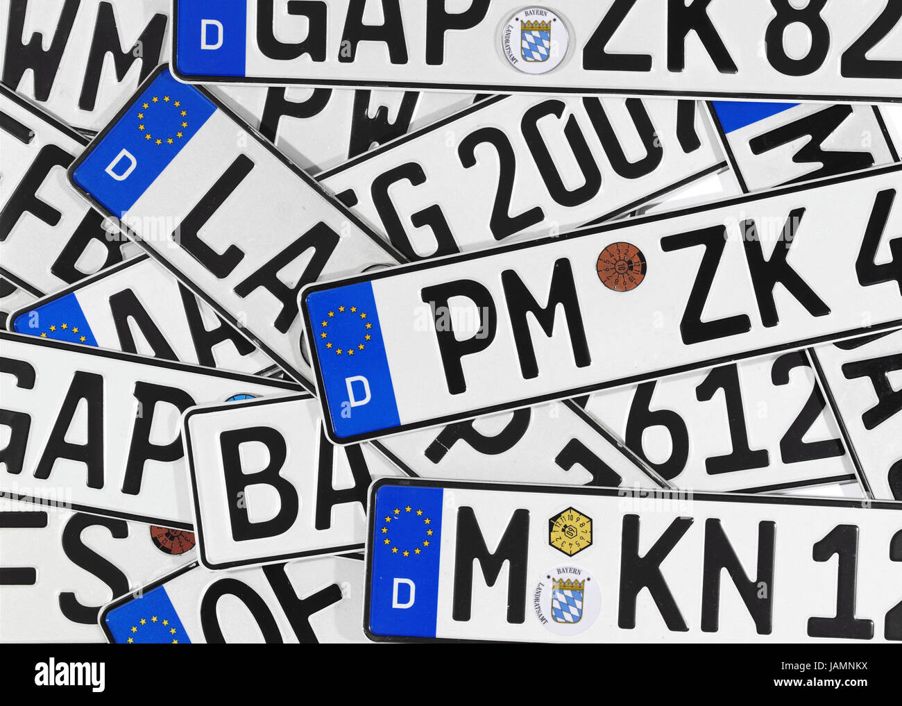 Car registration,mark,vehicle,number plates,in  German,German,many,differently,characters,the EU,EU  stars,European,Germany,exhaust emission test label,exhaust emission  test,safety standards authority,TüV label,test label,Stilllife,studio Stock  Photo - Alamy