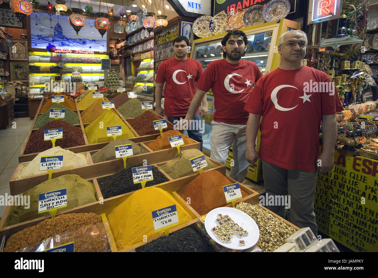 Turkey,Istanbul,spice market,business,seller,no model release,town,city,metropolis,port,culture,place of interest,bazaar,market,person,men,locals,Turks,T-shirts,red,national flag,product,offer,amount,choice,inside,heaps,spices, Stock Photo