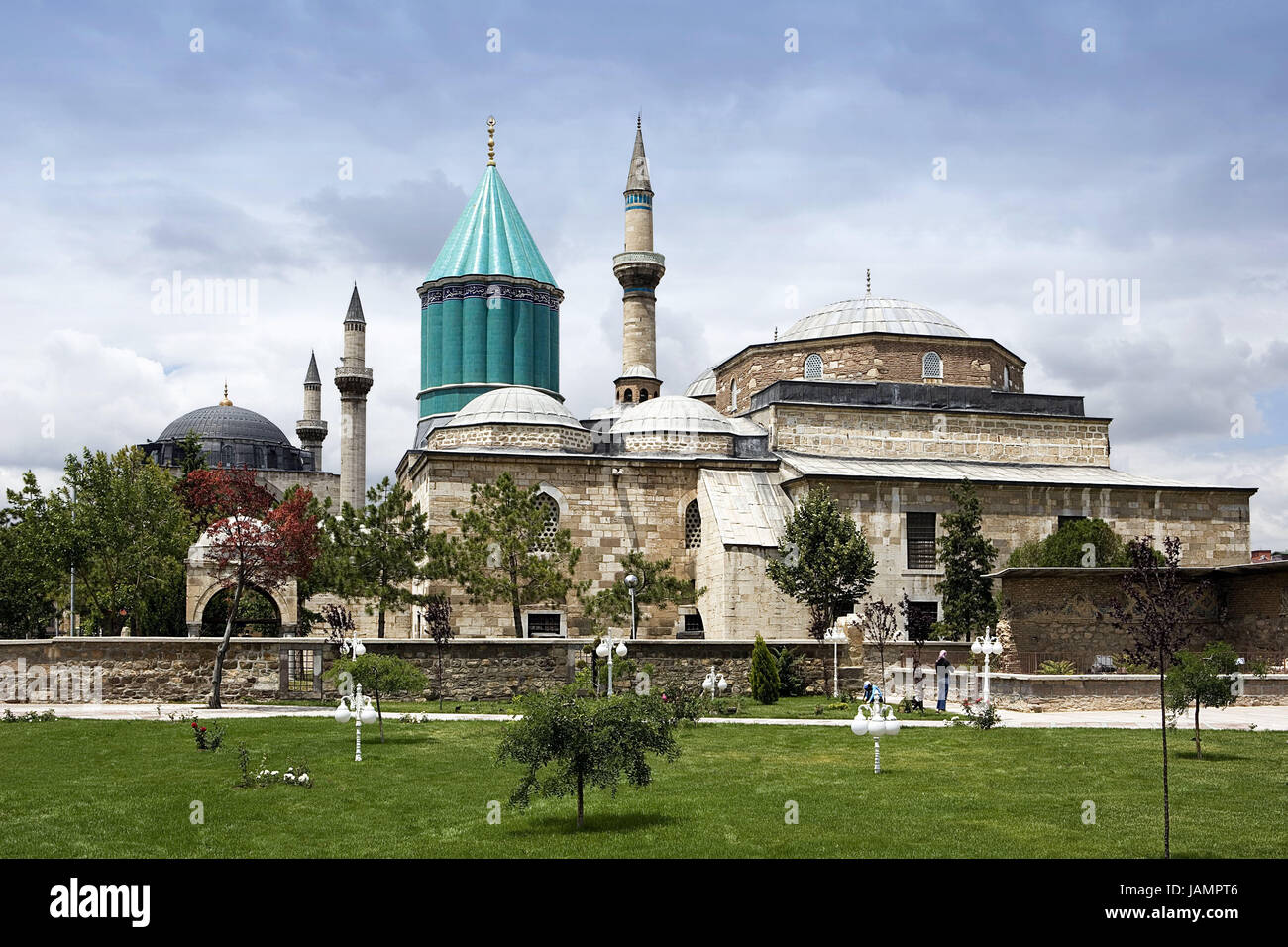 Turkey,Anatolia,Konya,Mevlana museum,park,tourist,Zentralanatolien,cloister attachment,building,structure,mosque,place of interest,destination,tourism,faith,religion,Islam,outside,architecture,towers,minarets,domes,tiles,tiled,turquoise,people,trees,meadow, Stock Photo